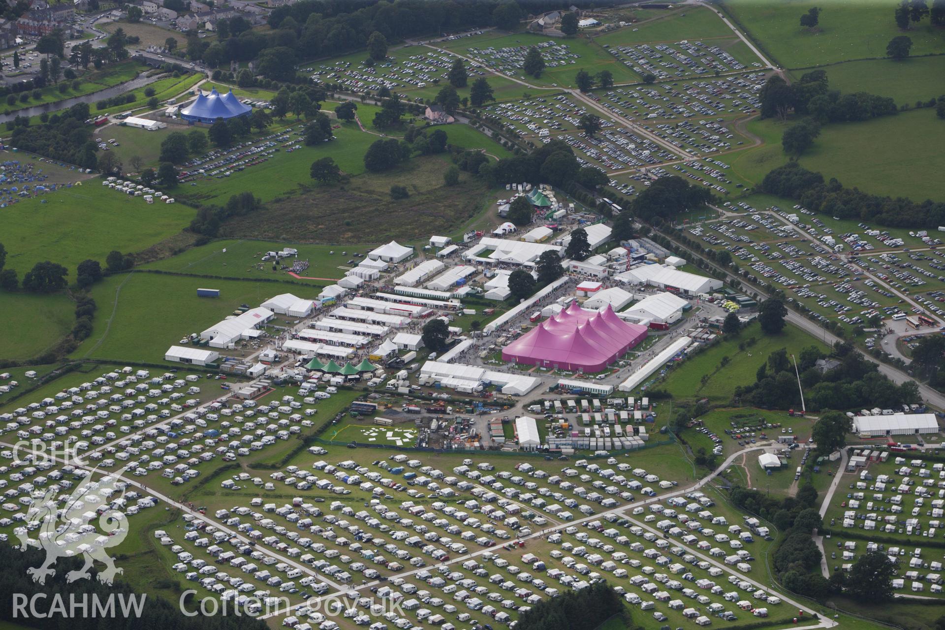 RCAHMW colour oblique aerial photograph of the site of the Eistedddfod at Bala in 1997 and 2009. Taken on 06 August 2009 by Toby Driver