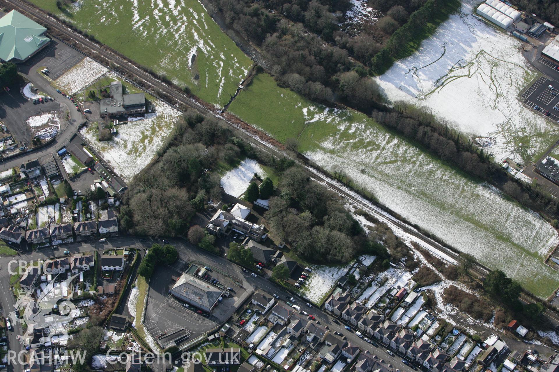 RCAHMW colour oblique photograph of Tir-y-Dail motte and bailey, Ammanford. Taken by Toby Driver on 06/02/2009.