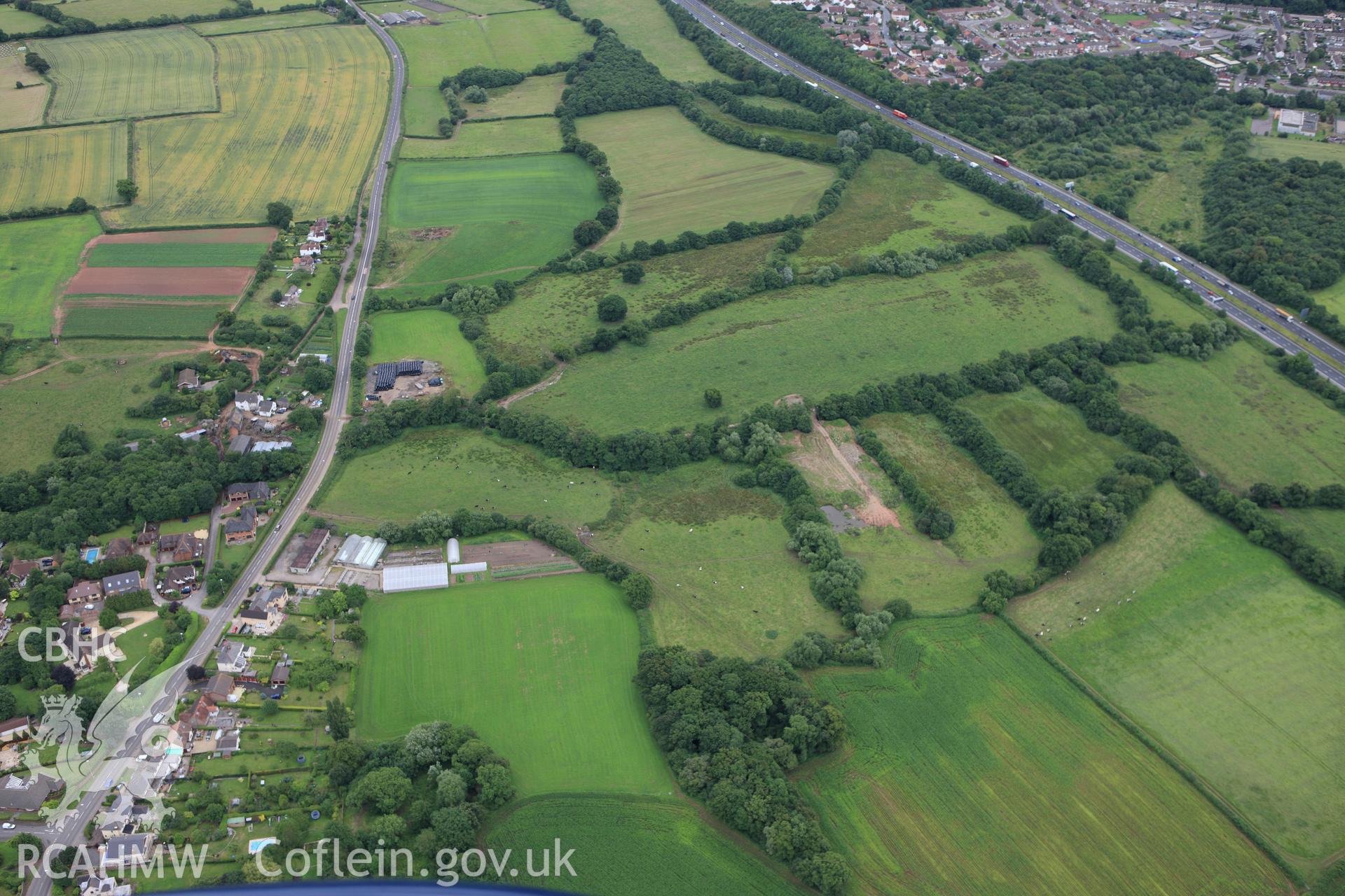 RCAHMW colour oblique aerial photograph of Ford Farm Roman Villa, Langstone. Taken on 09 July 2009 by Toby Driver