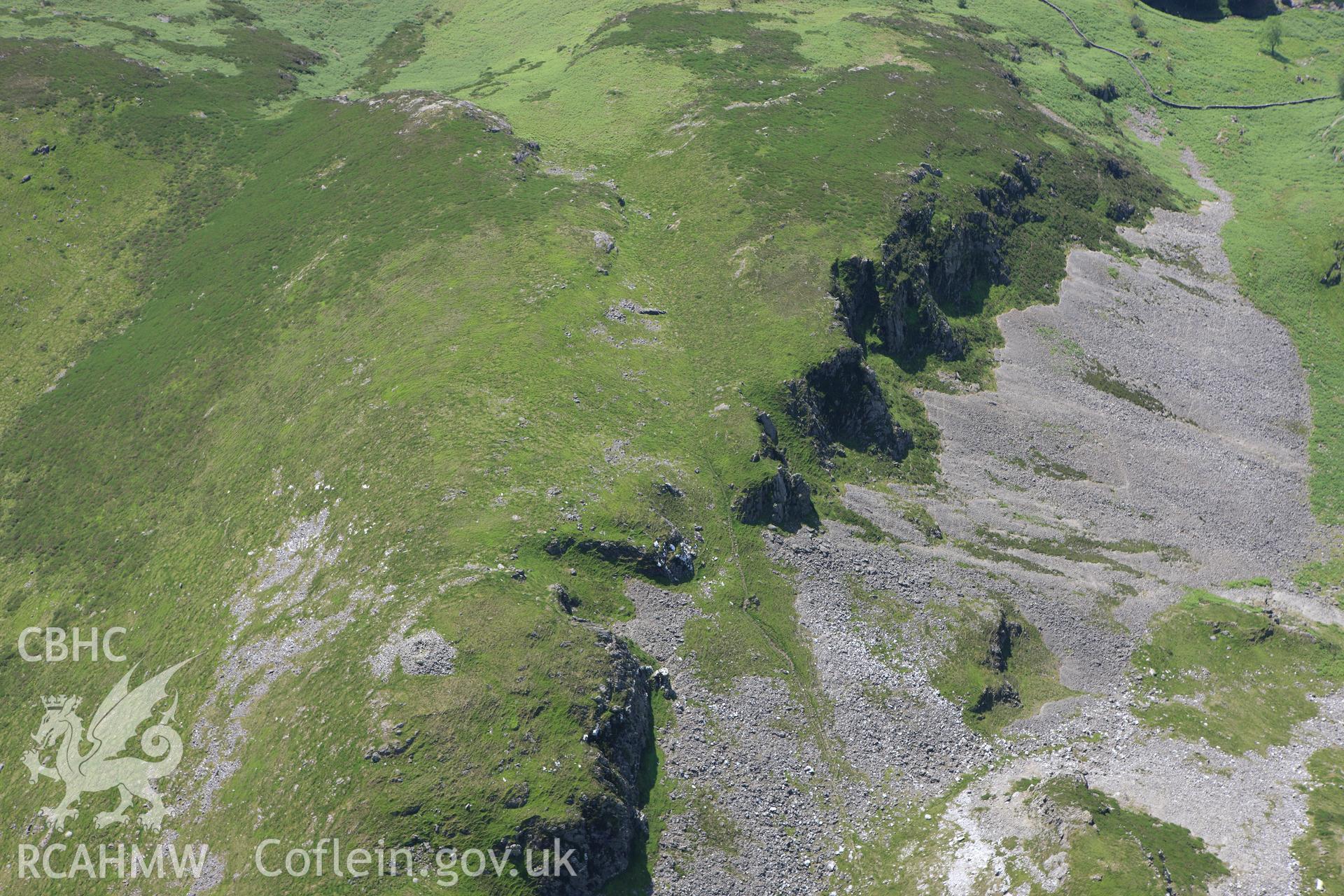 RCAHMW colour oblique aerial photograph of Craig Yr Aderyn Cairn. The cairn to the south. Taken on 02 June 2009 by Toby Driver