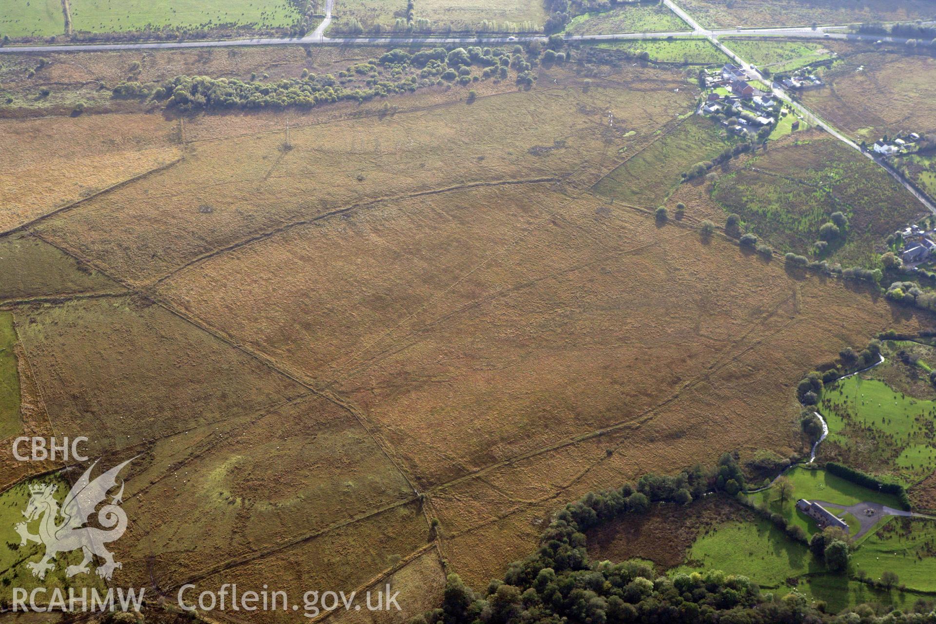 RCAHMW colour oblique aerial photograph of Roman Marching Camp southeast of Coelbren Fort. Taken on 14 October 2009 by Toby Driver