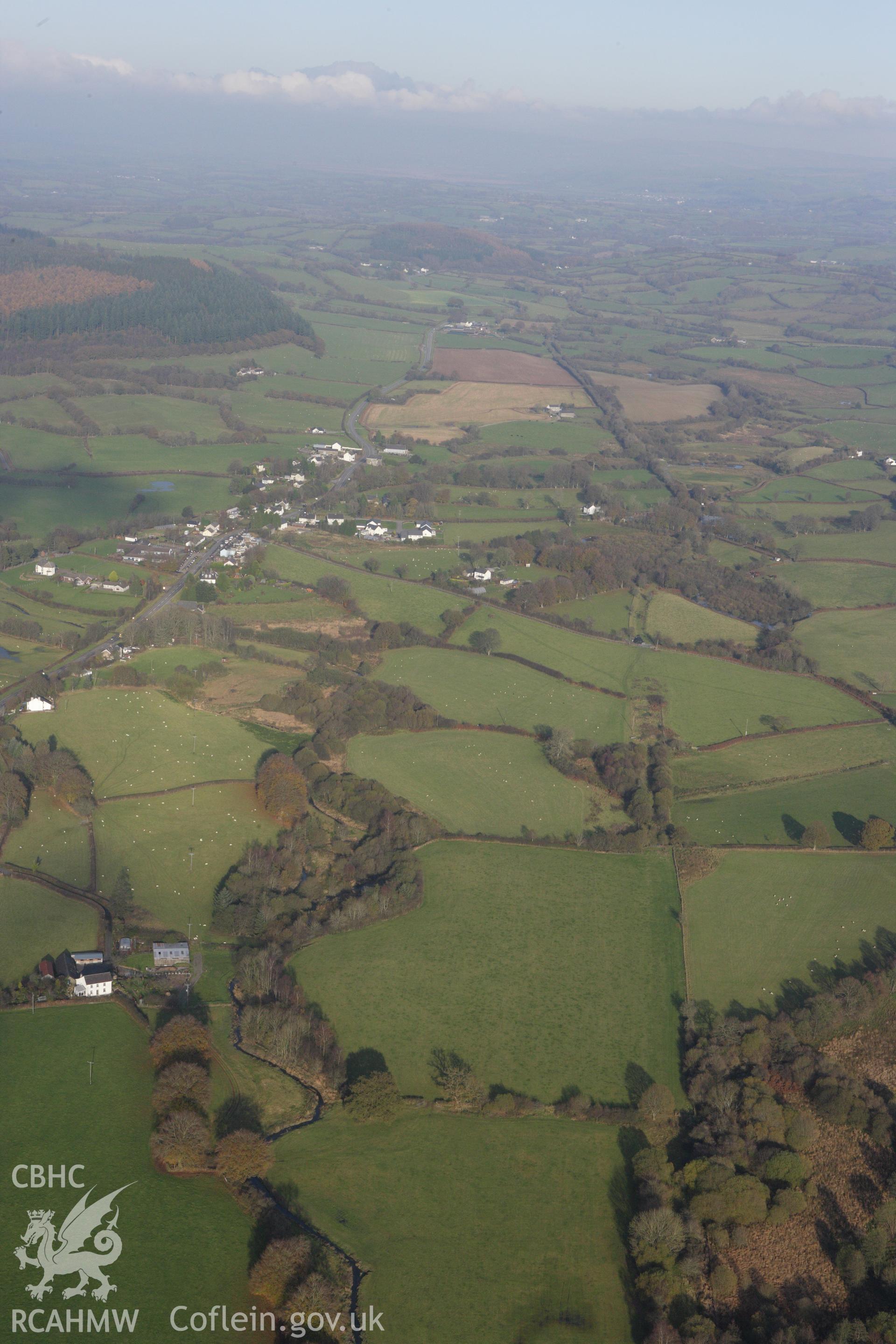 RCAHMW colour oblique aerial photograph of Llangybi viewed from the south-west. Taken on 09 November 2009 by Toby Driver