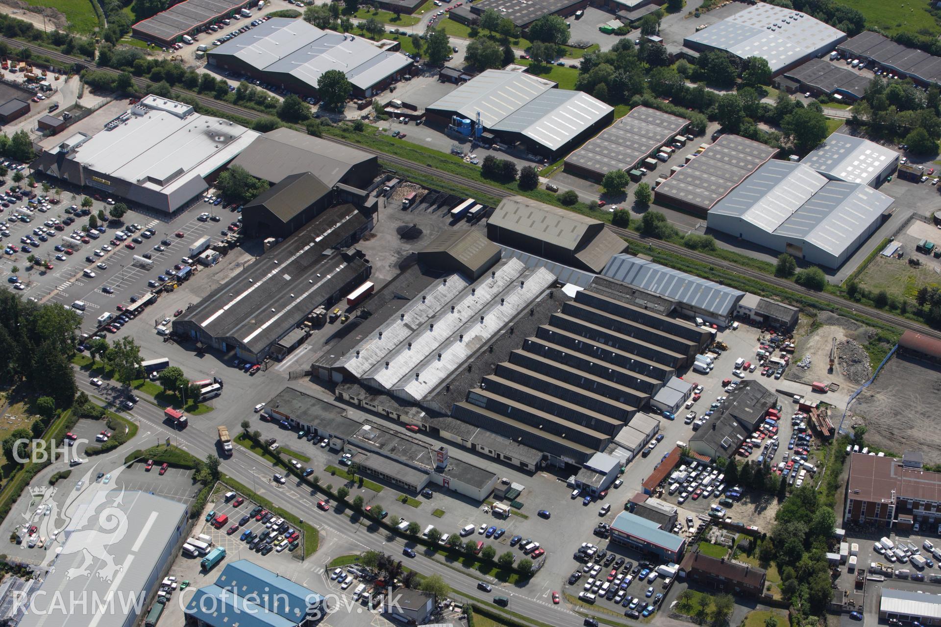 RCAHMW colour oblique aerial photograph of Lion Works, Aircraft factory, Newtown Industrial Estate. Taken on 02 June 2009 by Toby Driver