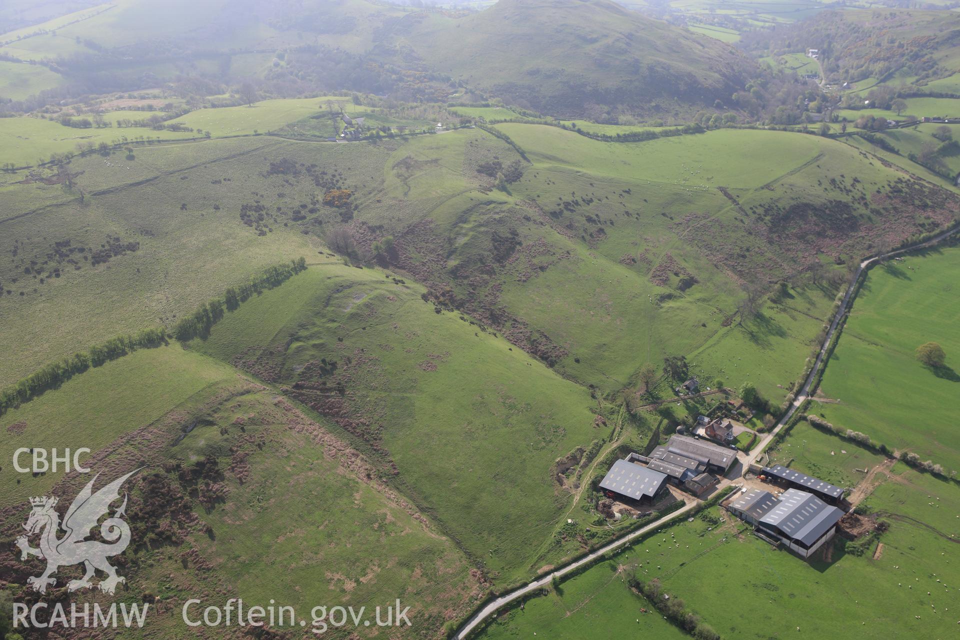 RCAHMW colour oblique aerial photograph of stone quarries, Upper Aldress. Taken on 21 April 2009 by Toby Driver