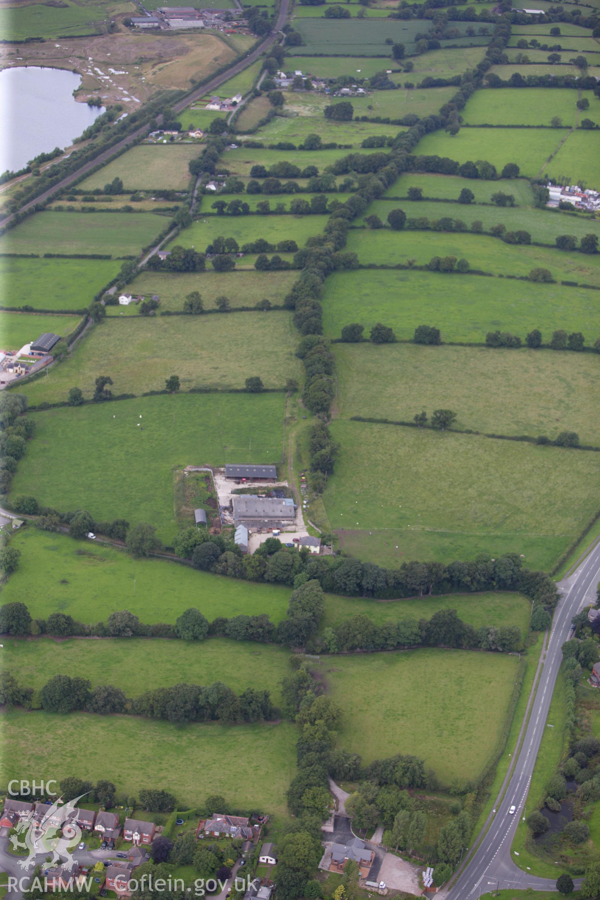 RCAHMW colour oblique aerial photograph of two sections of Wat's Dyke between Clawdd Offa and Pigeon House Farm. Taken on 30 July 2009 by Toby Driver