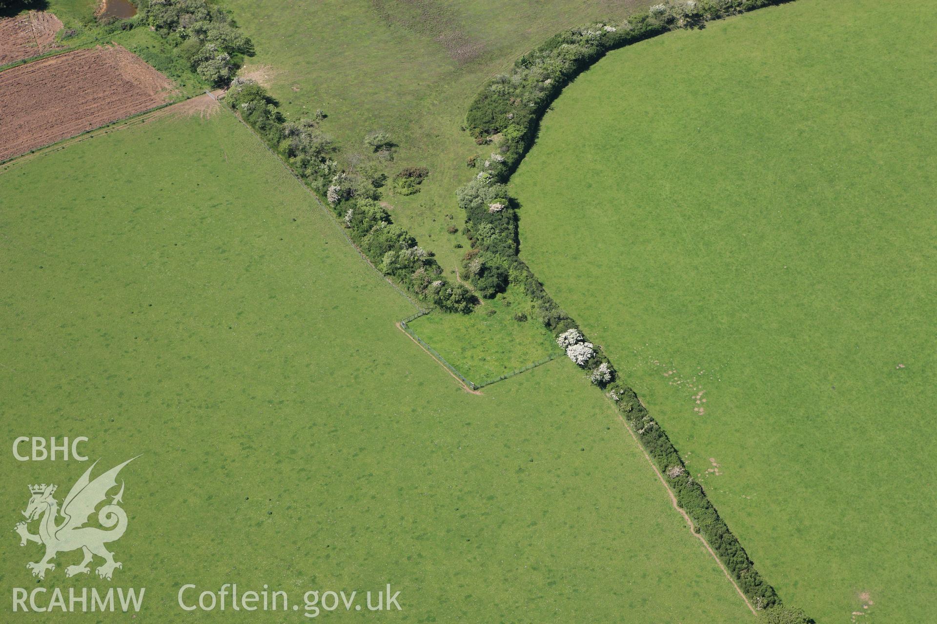 RCAHMW colour oblique aerial photograph of a burnt mound 240m northeast  of Highway Park. Taken on 01 June 2009 by Toby Driver