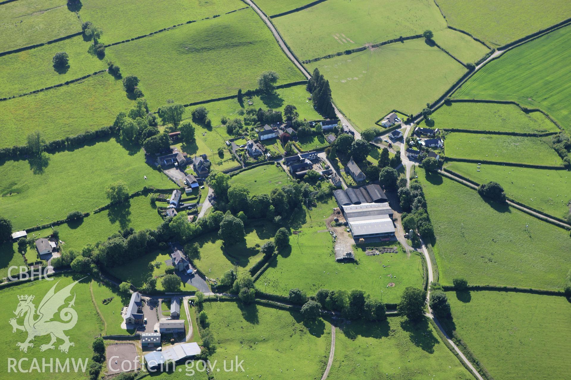 RCAHMW colour oblique aerial photograph of Kinnerton Court Motte. Taken on 11 June 2009 by Toby Driver