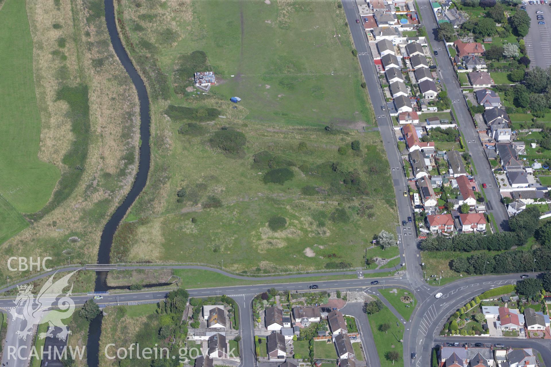 RCAHMW colour oblique aerial photograph of Prestatyn Castle. Taken on 30 July 2009 by Toby Driver