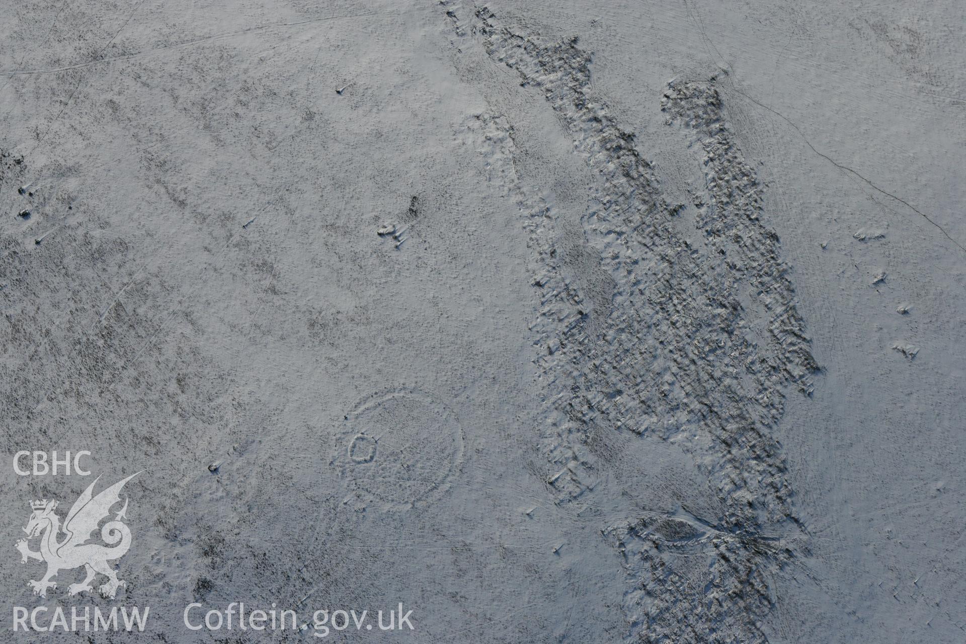 RCAHMW colour oblique photograph of Twyn Tyle ring cairn. Taken by Toby Driver on 06/02/2009.