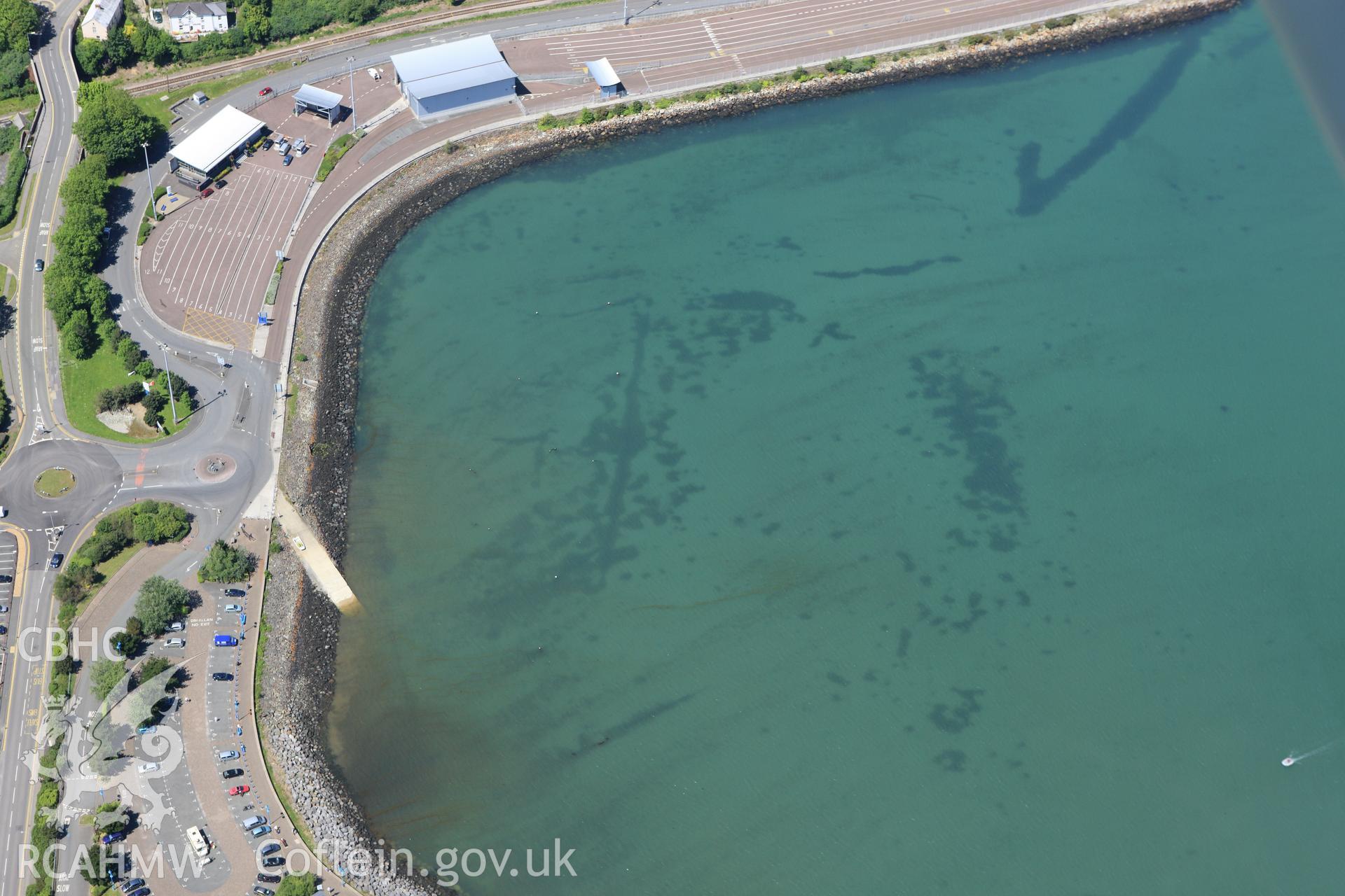 RCAHMW colour oblique aerial photograph of Fishguard Harbour North-West Fish Trap. Taken on 01 June 2009 by Toby Driver