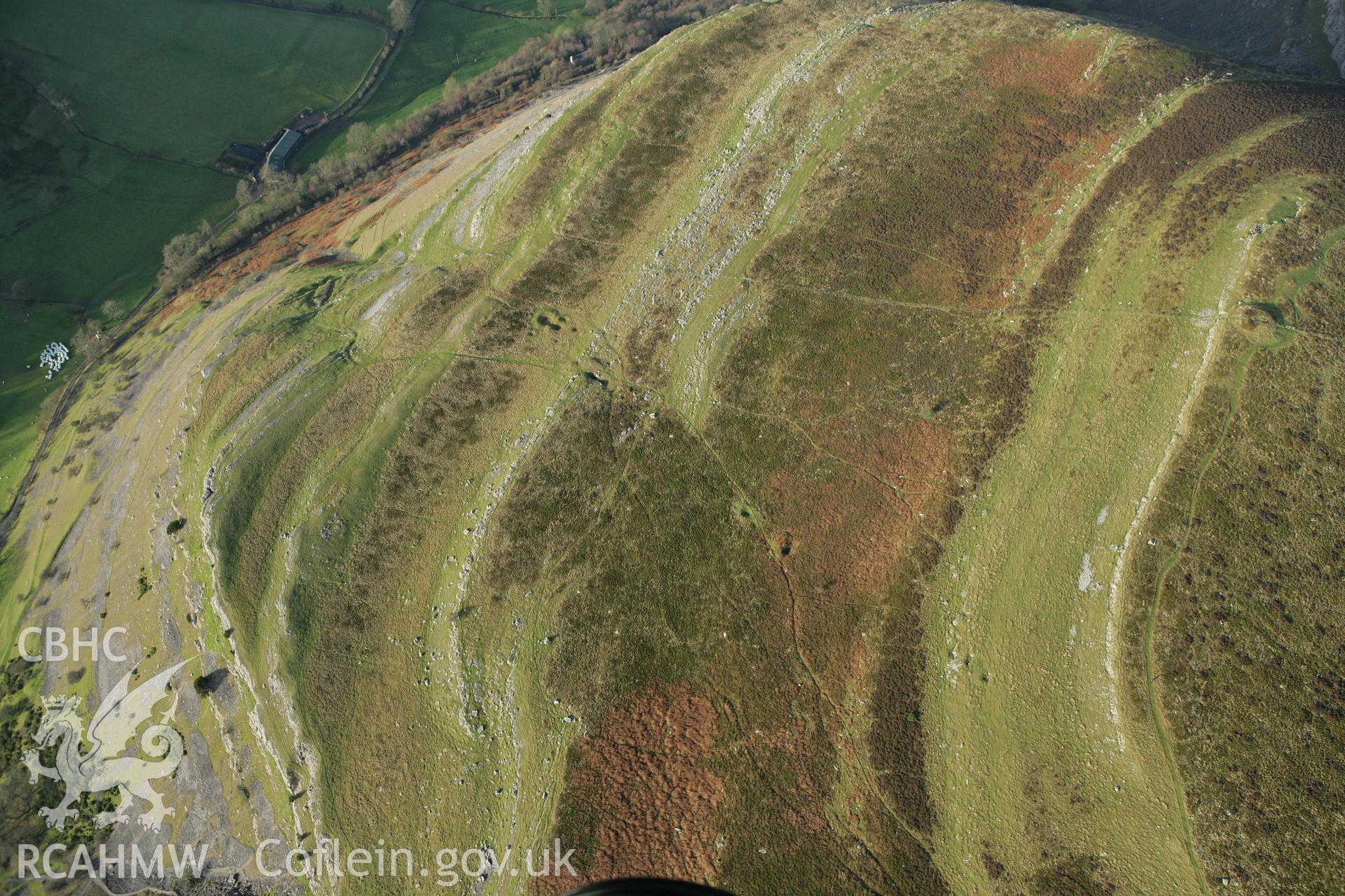 RCAHMW colour oblique aerial photograph of landscape to the north of Mound I, Creigiau Eglwyseg. Taken on 10 December 2009 by Toby Driver