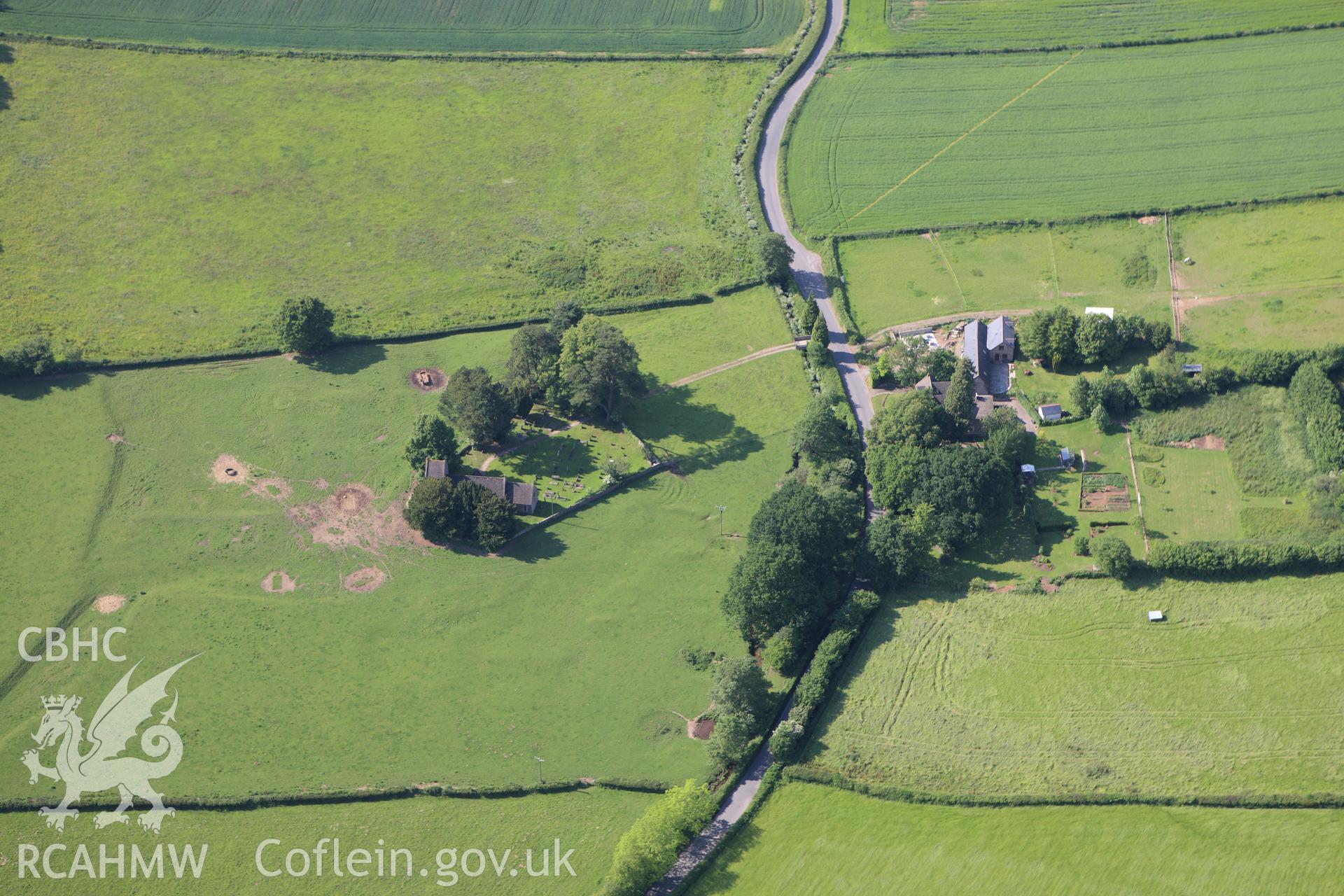 RCAHMW colour oblique aerial photograph of a settlement at St. Brides, Netherwent. Taken on 11 June 2009 by Toby Driver