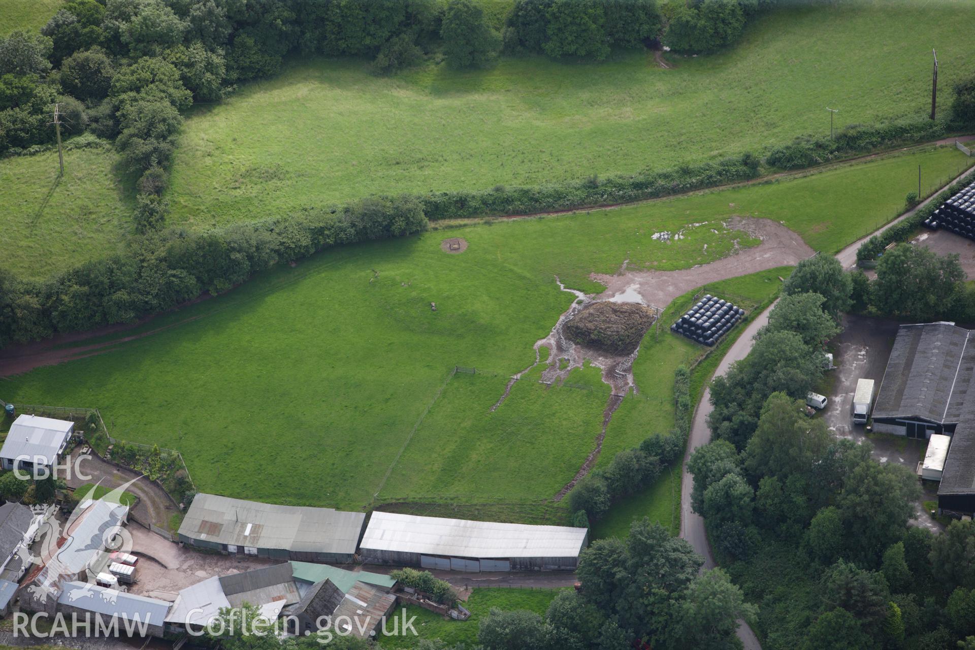 RCAHMW colour oblique aerial photograph of Ty-Isaf Chambered Cairn. Taken on 23 July 2009 by Toby Driver