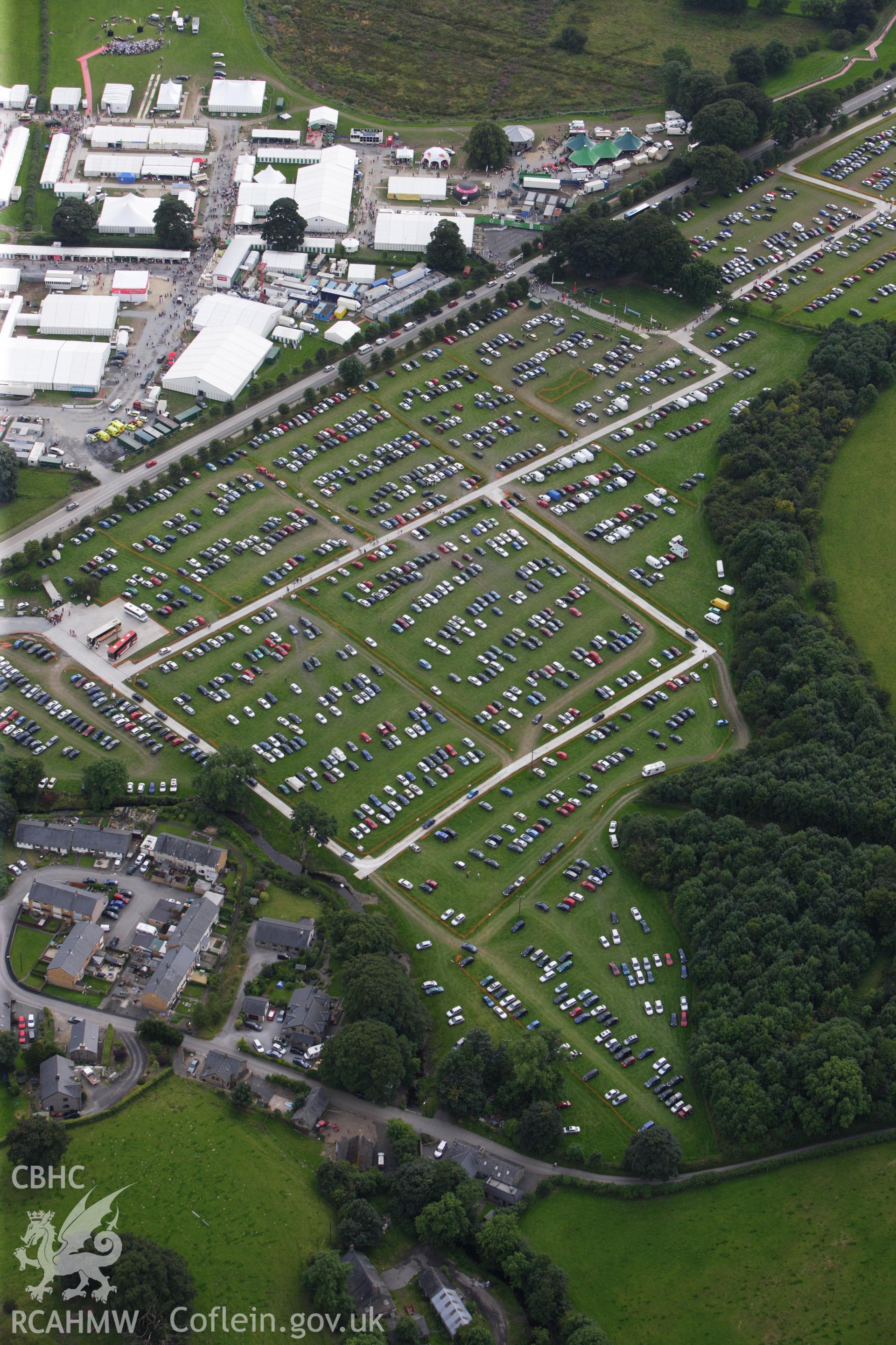 RCAHMW colour oblique aerial photograph of the site of the Eistedddfod at Bala in 1997 and 2009. Taken on 06 August 2009 by Toby Driver