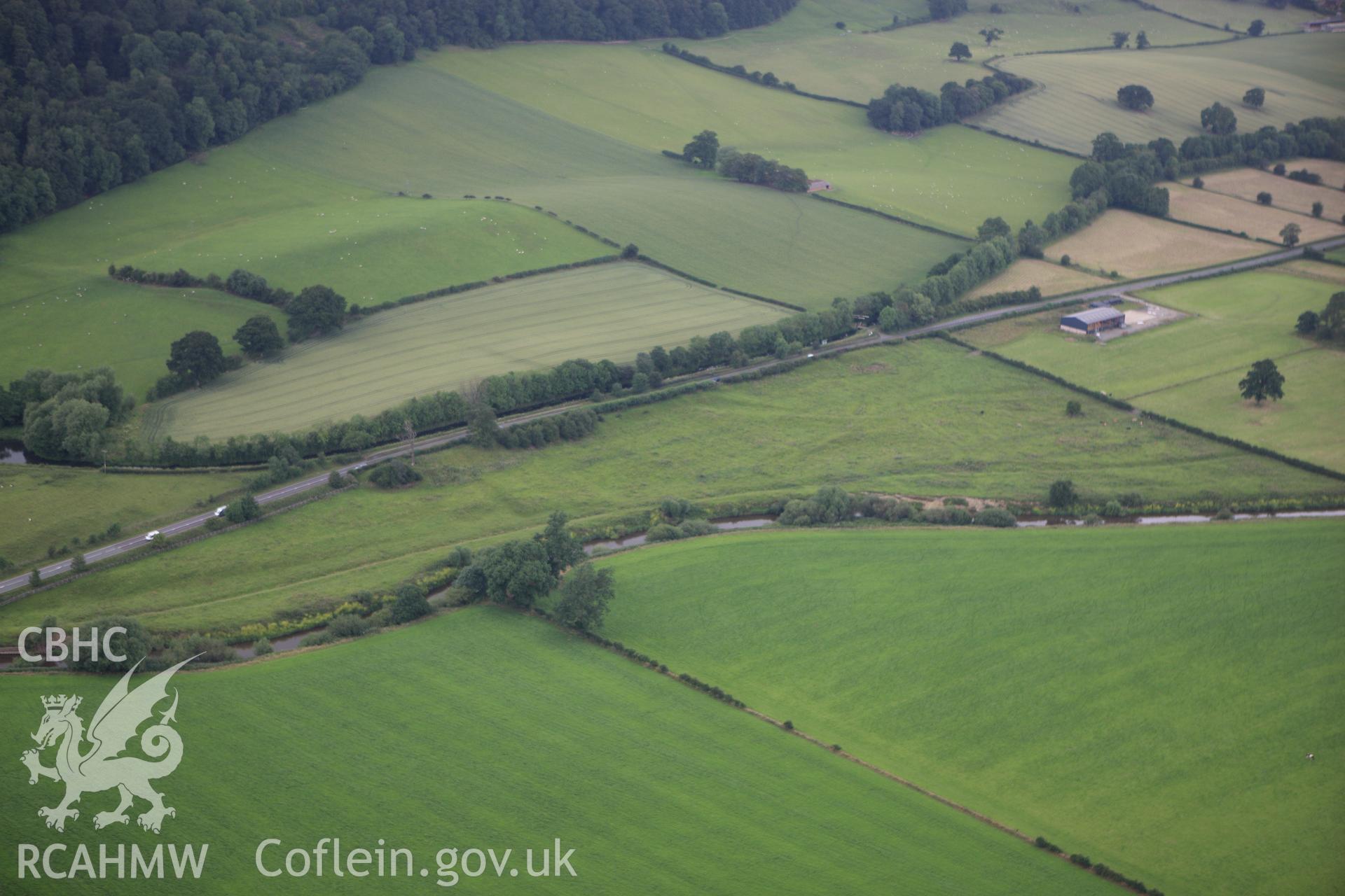 RCAHMW colour oblique aerial photograph of Strata Marcella Abbey. Taken on 08 July 2009 by Toby Driver