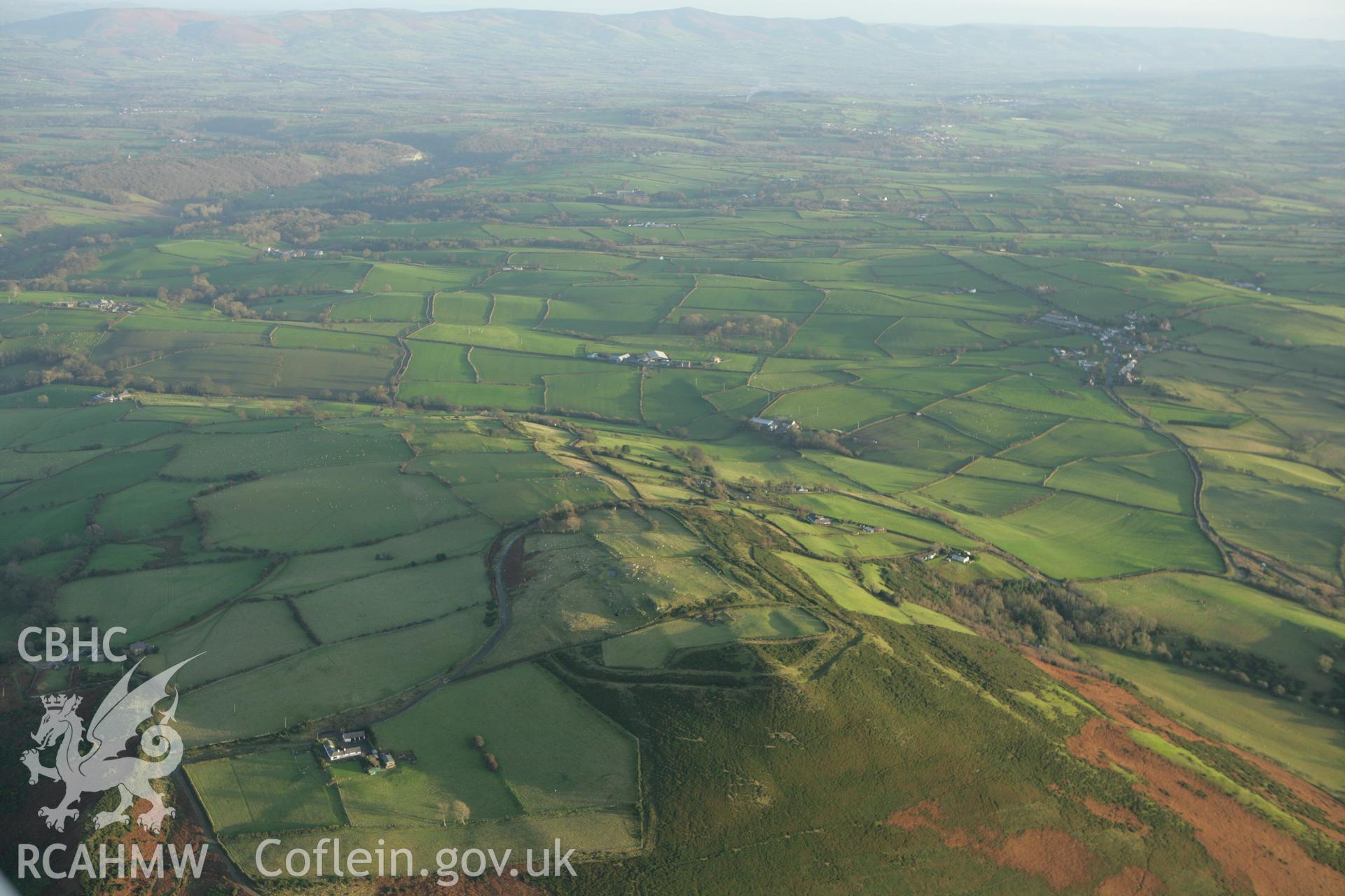 RCAHMW colour oblique aerial photograph of Mynydd y Gaer Hillfort. Taken on 10 December 2009 by Toby Driver