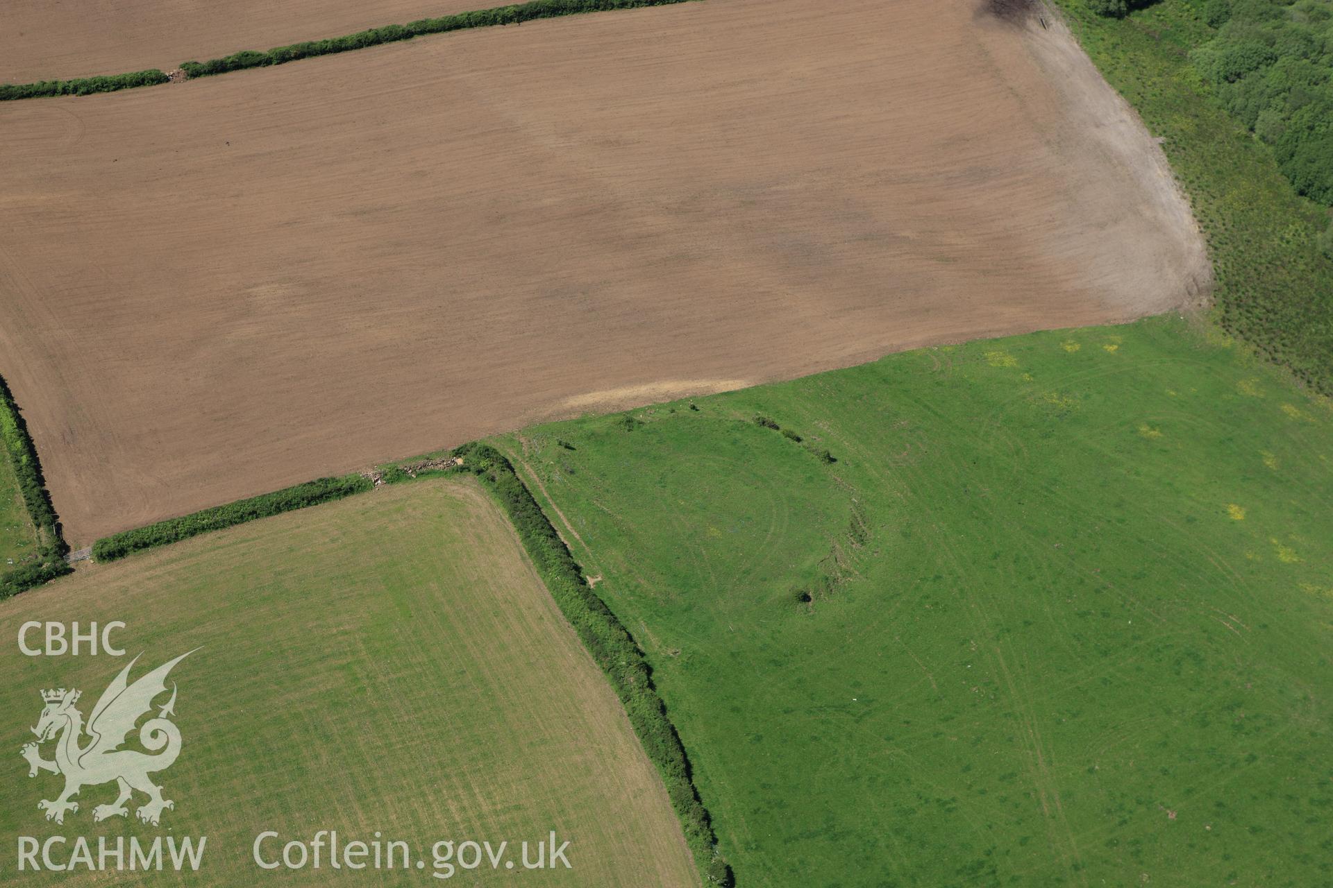 RCAHMW colour oblique aerial photograph of Ford Camp showing ploughing. Taken on 01 June 2009 by Toby Driver