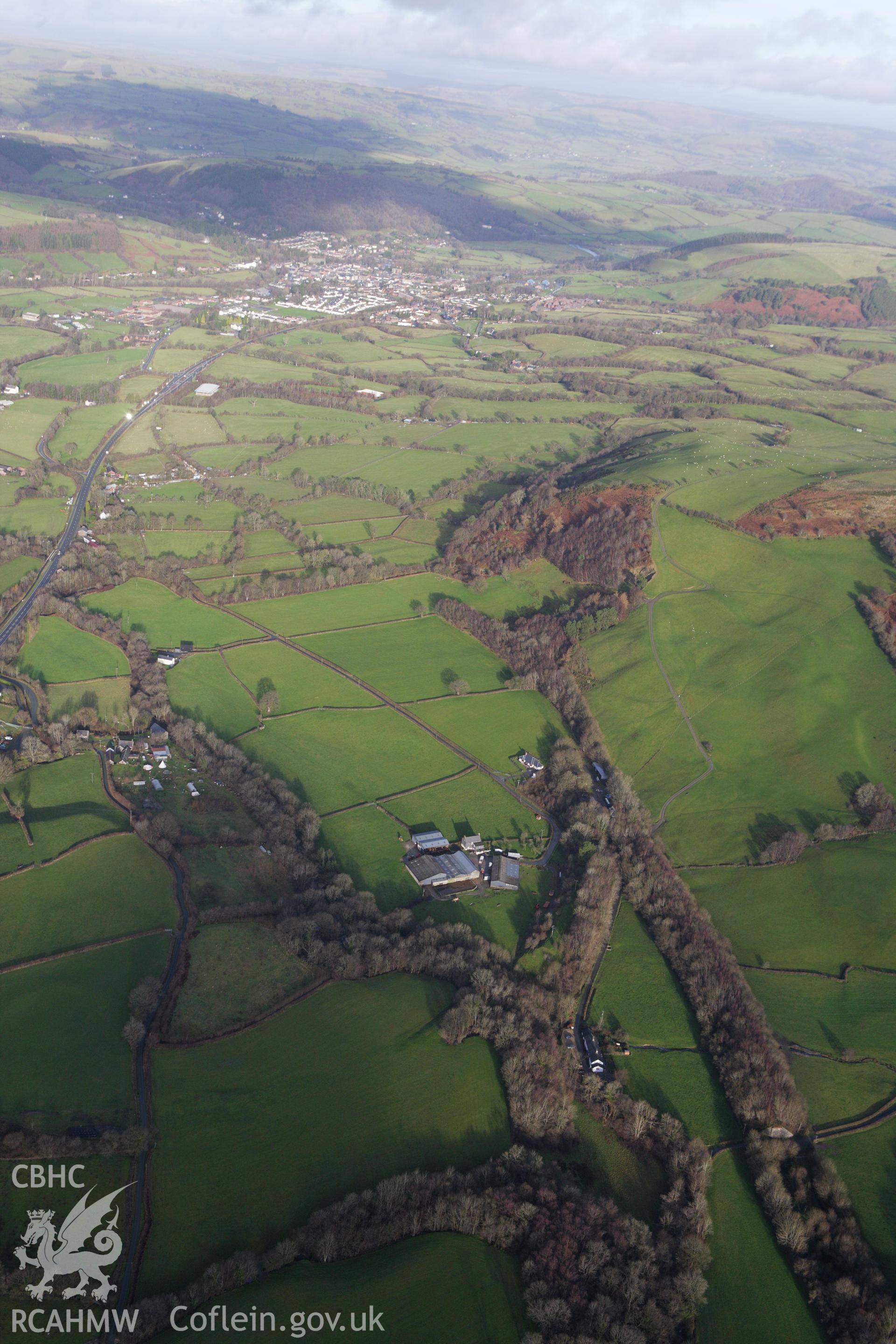 RCAHMW colour oblique aerial photograph of a section of the dismantled Manchester and Milford Railway between Llangurig and Llanidloes. Taken on 10 December 2009 by Toby Driver