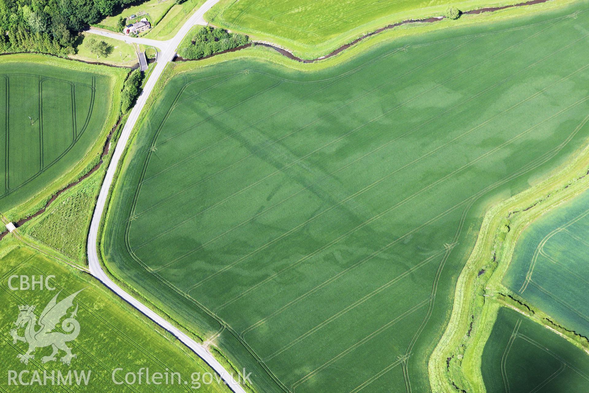 RCAHMW colour oblique aerial photograph of Ditchyeld Bridge Defended Enclosure. Taken on 11 June 2009 by Toby Driver