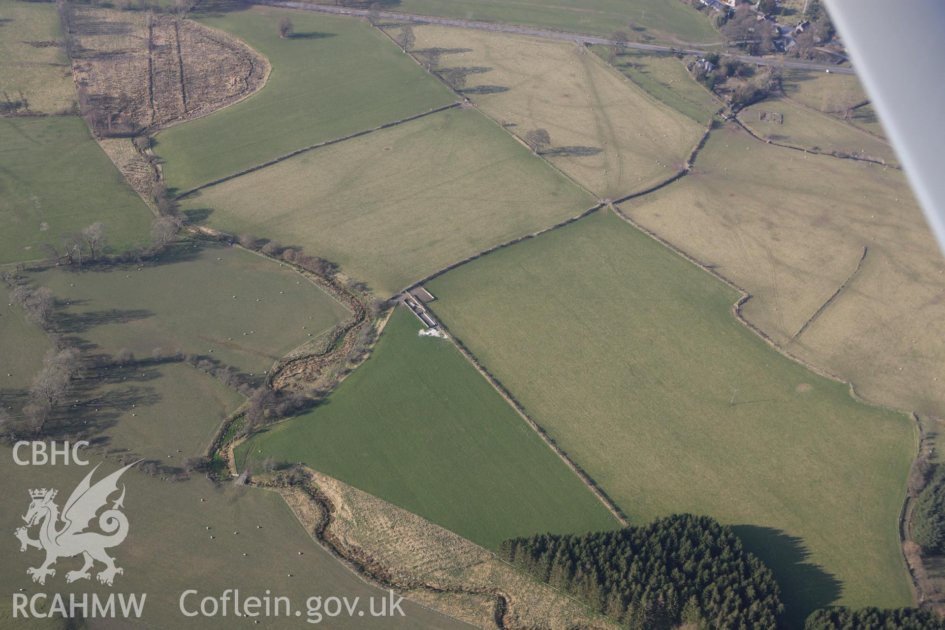 RCAHMW colour oblique photograph of Site of Llanfor Roman fort. Taken by Toby Driver on 18/03/2009.