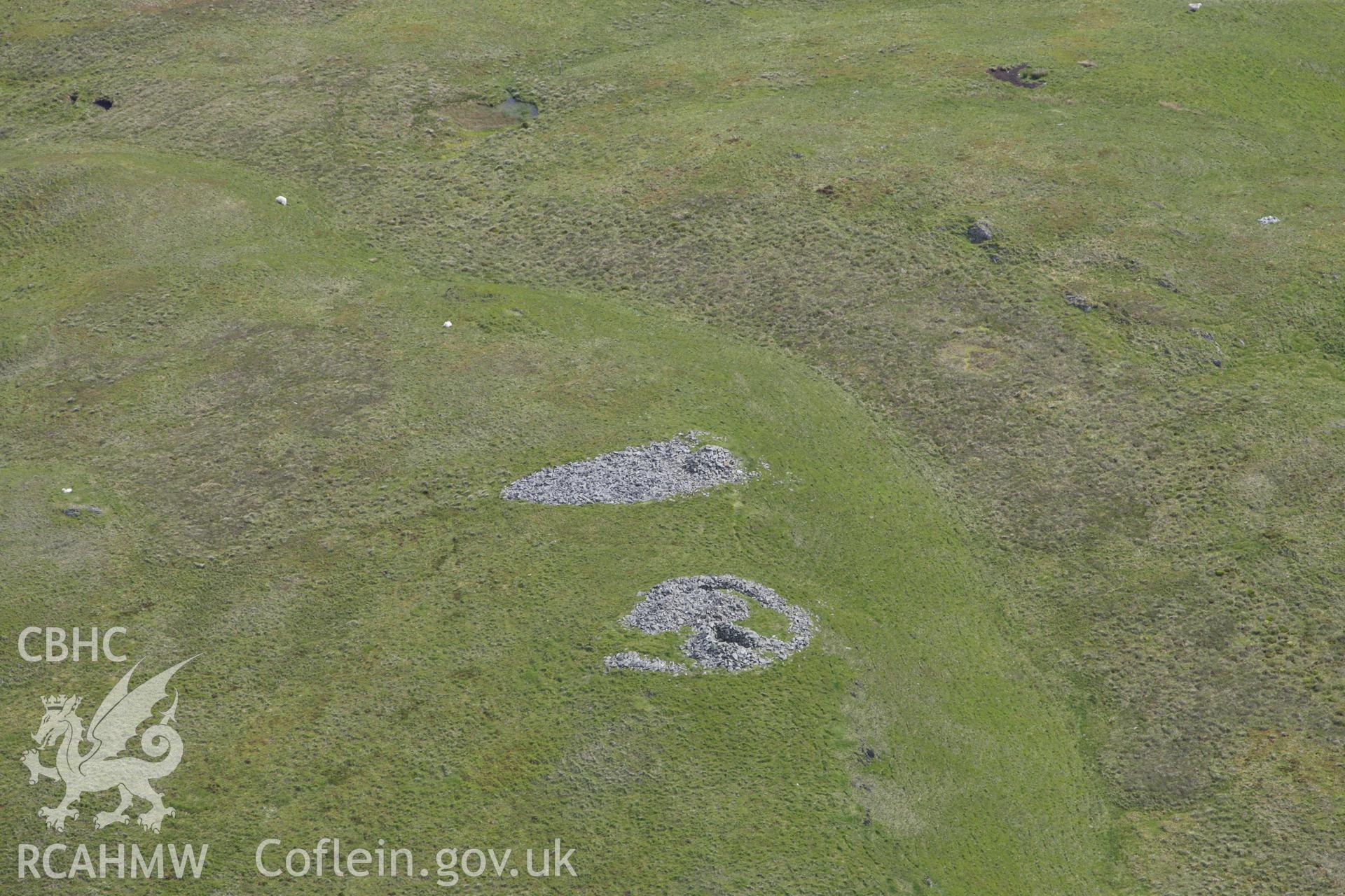 RCAHMW colour oblique aerial photograph of Drosgol Carneddau Cairns I and II. Taken on 02 June 2009 by Toby Driver