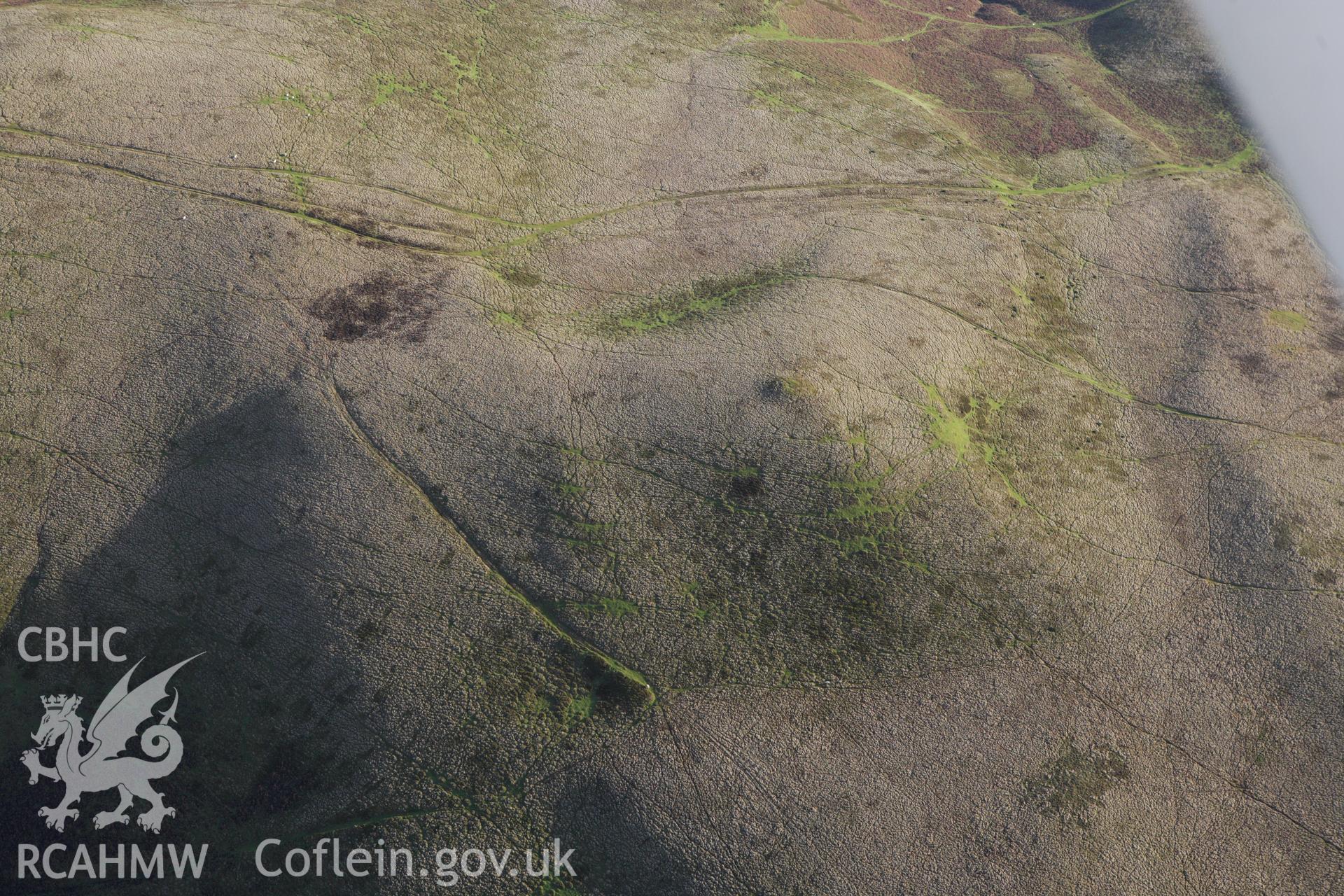 RCAHMW colour oblique aerial photograph of Rhos Crug Barrow III. Taken on 10 December 2009 by Toby Driver