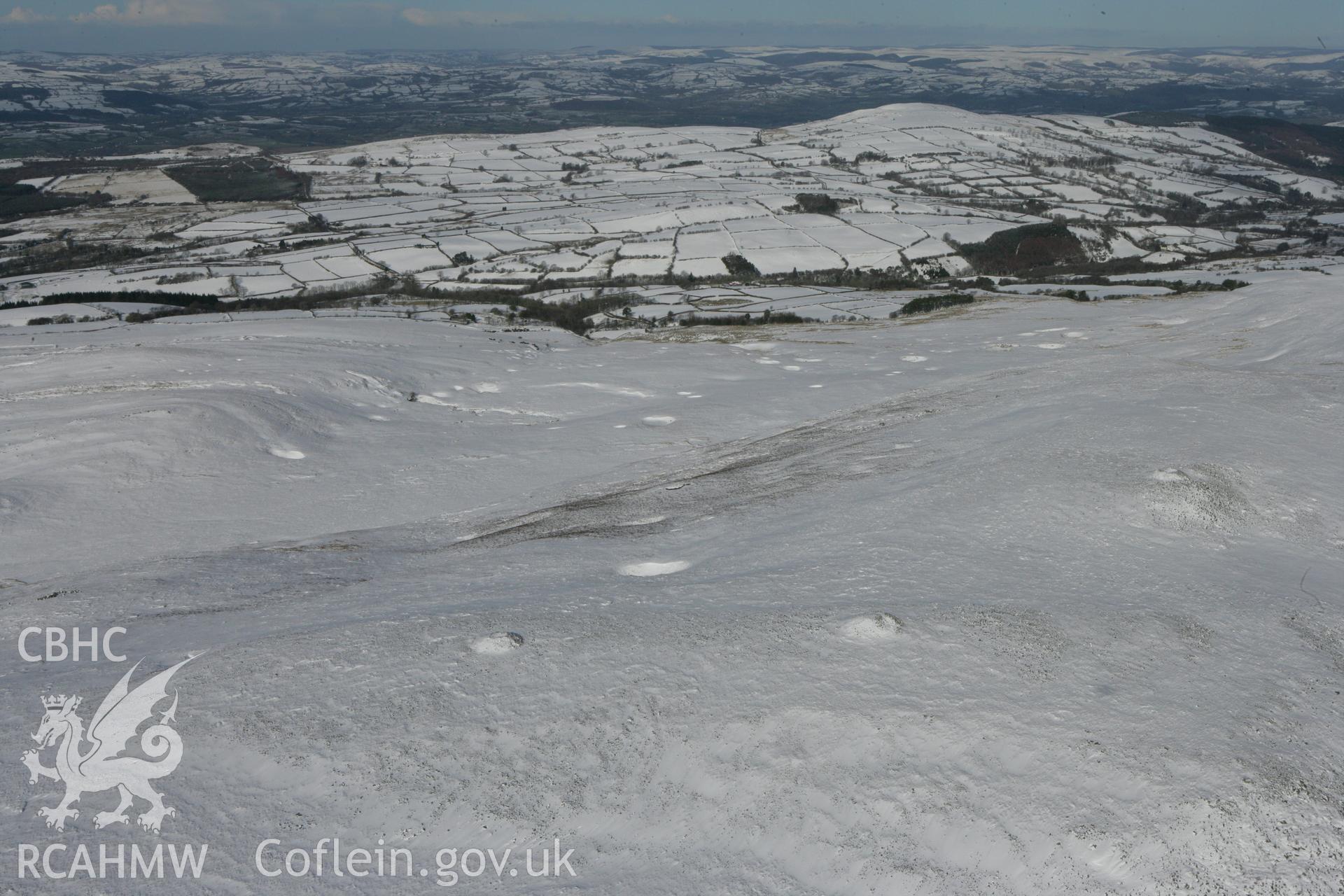 RCAHMW colour oblique photograph of Tair Carn Isaf, cairns. Taken by Toby Driver on 06/02/2009.