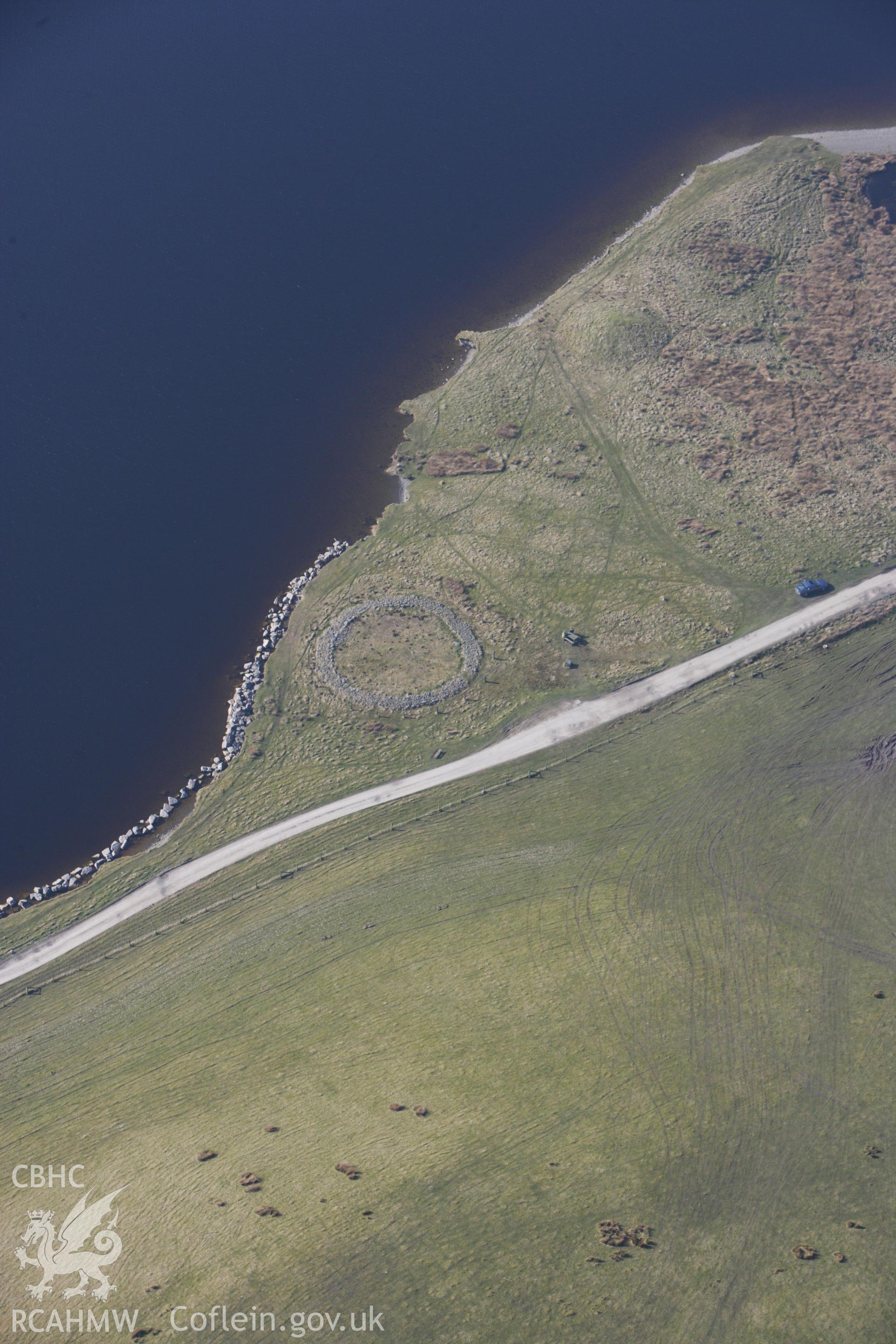 RCAHMW colour oblique photograph of Ring Cairn: Brenig 44. Taken by Toby Driver on 18/03/2009.