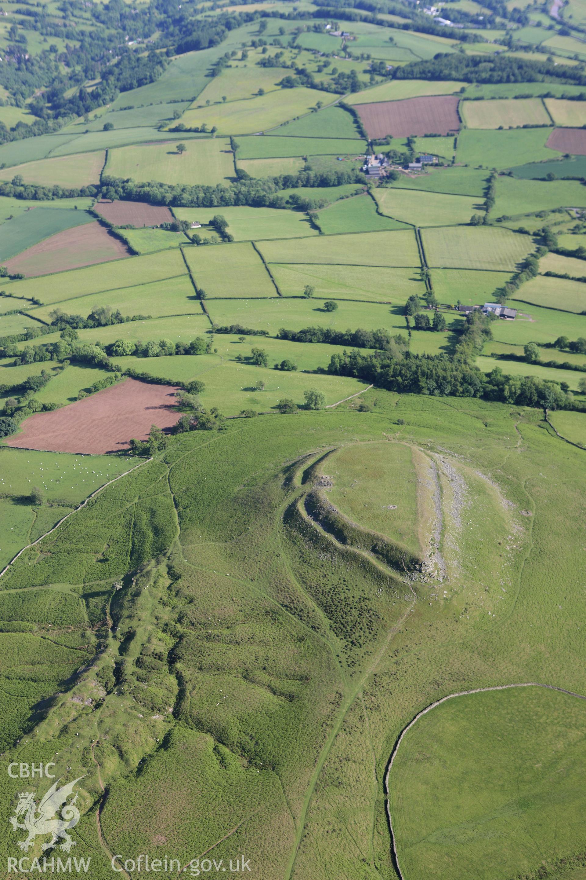 RCAHMW colour oblique aerial photograph of Crug Hywel Camp. Taken on 11 June 2009 by Toby Driver