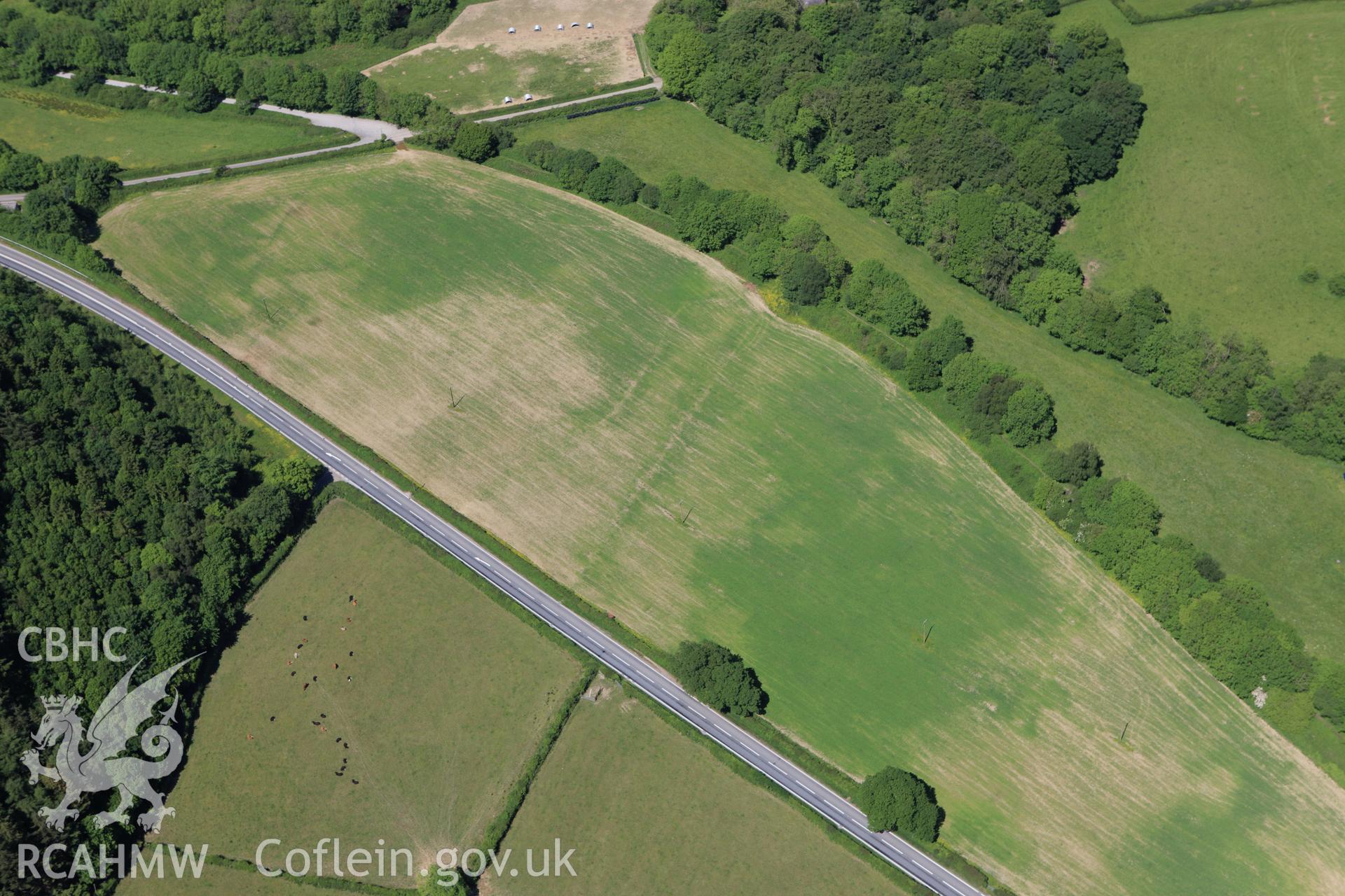 RCAHMW colour oblique aerial photograph of fields nera Llannerch-Aeron Halt. Taken on 01 June 2009 by Toby Driver