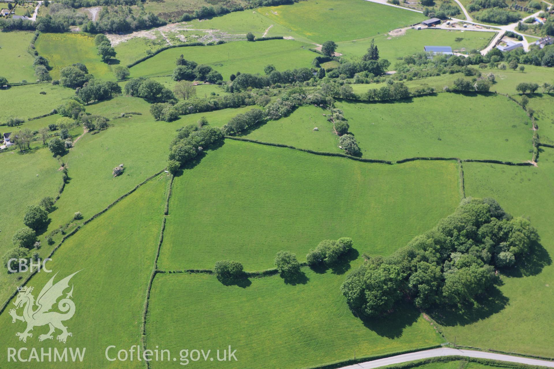 RCAHMW colour oblique aerial photograph of Pen-y-Castell Hillfort. Taken on 02 June 2009 by Toby Driver