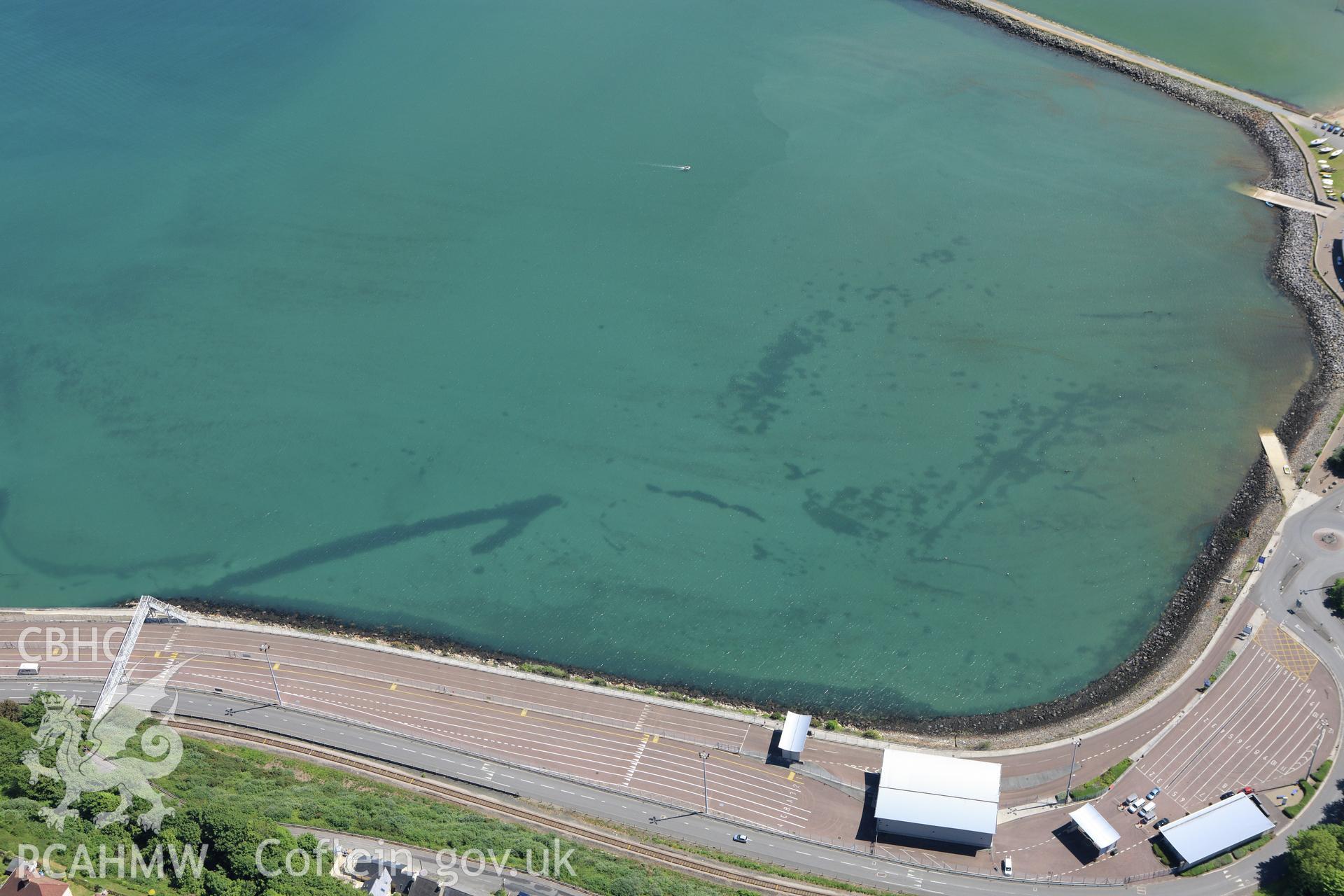 RCAHMW colour oblique aerial photograph of Fishguard Harbour North-West Fish Trap. Taken on 01 June 2009 by Toby Driver