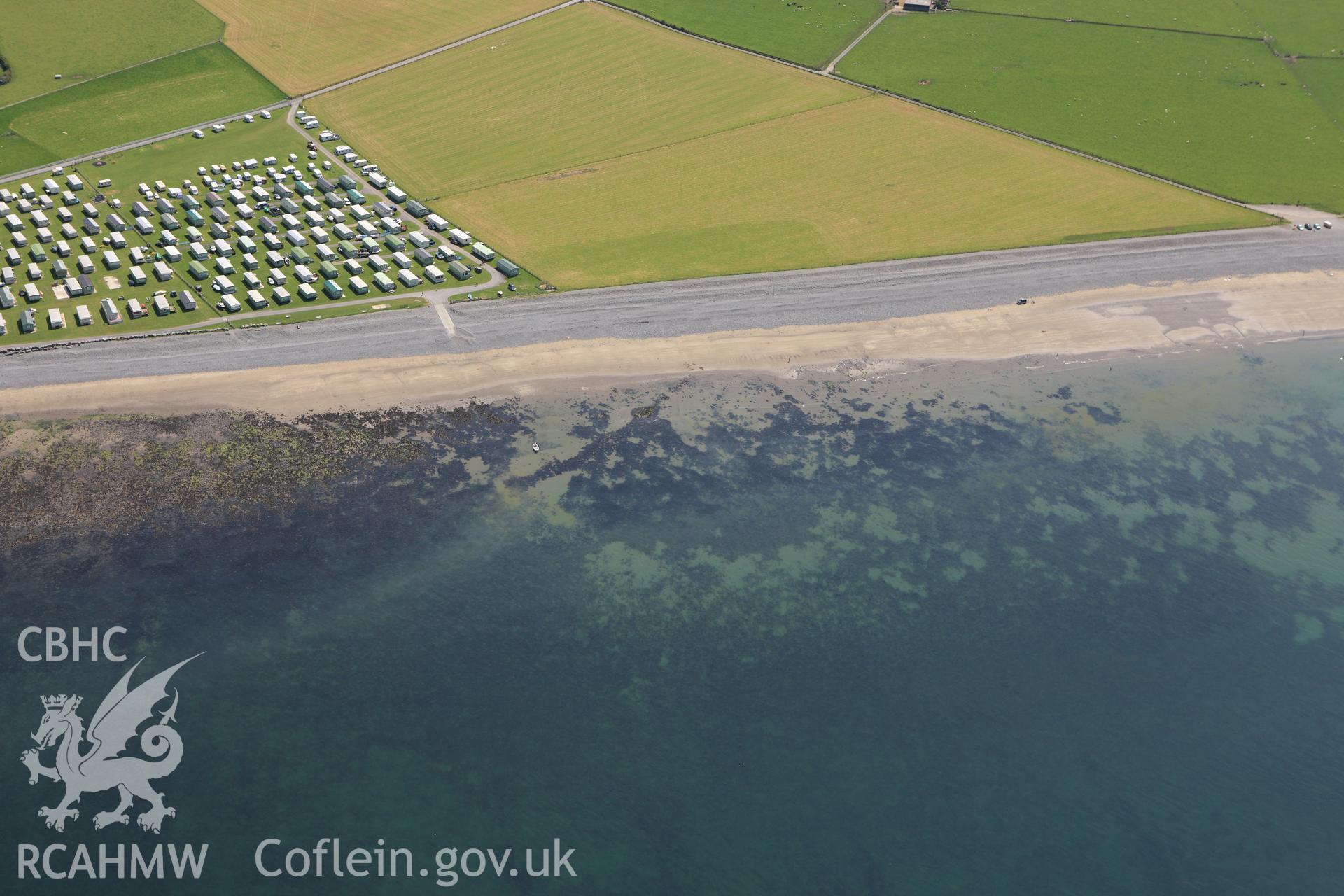 RCAHMW colour oblique aerial photograph of possible fish traps or submerged structures at Llanrhystud. Taken on 02 June 2009 by Toby Driver