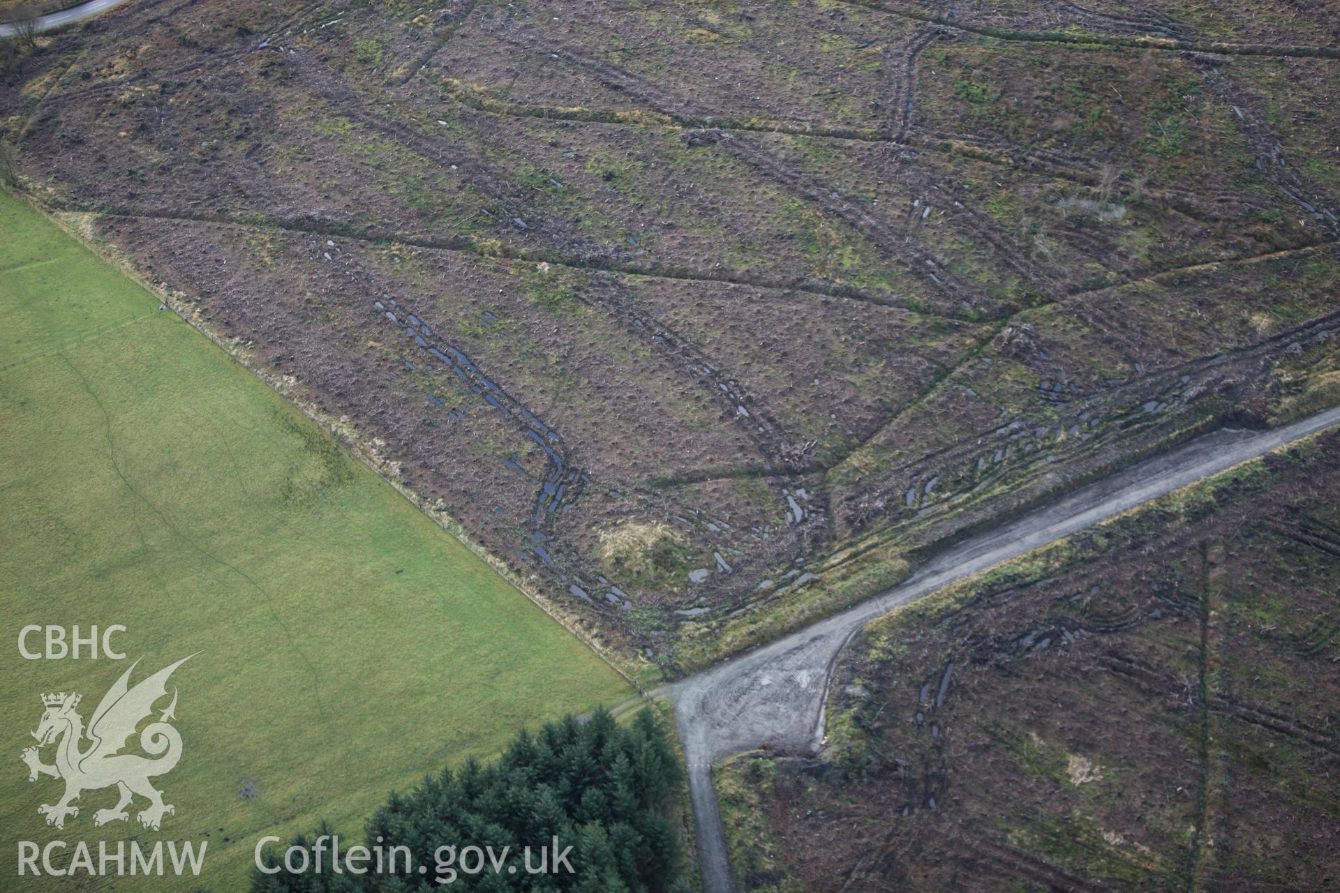 RCAHMW colour oblique aerial photograph of Block Wood Barrow. Taken on 10 December 2009 by Toby Driver