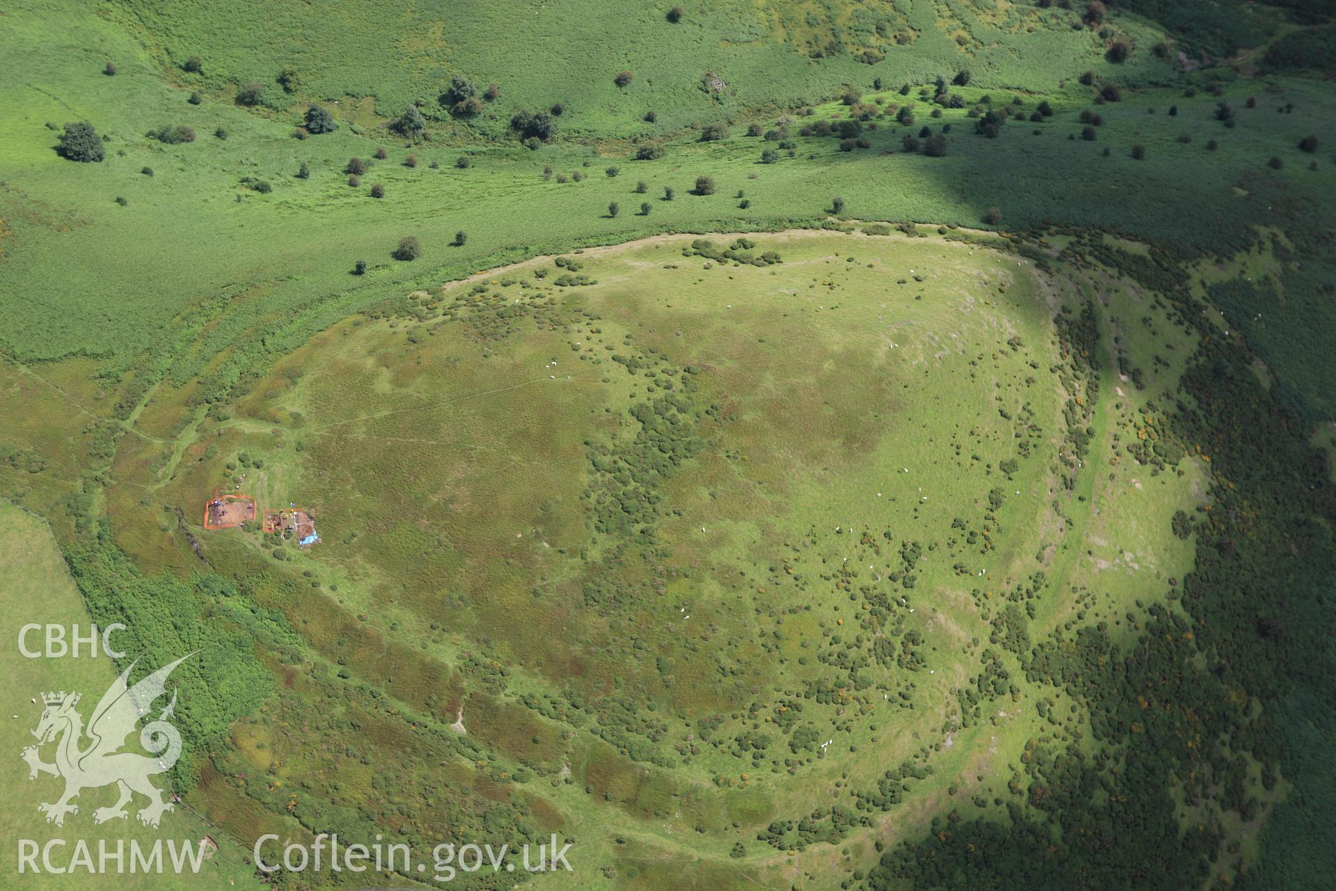 RCAHMW colour oblique aerial photograph of Moel-y-Gaer Hillfort, Llanbedr, with Bangor University excavations. Taken on 30 July 2009 by Toby Driver