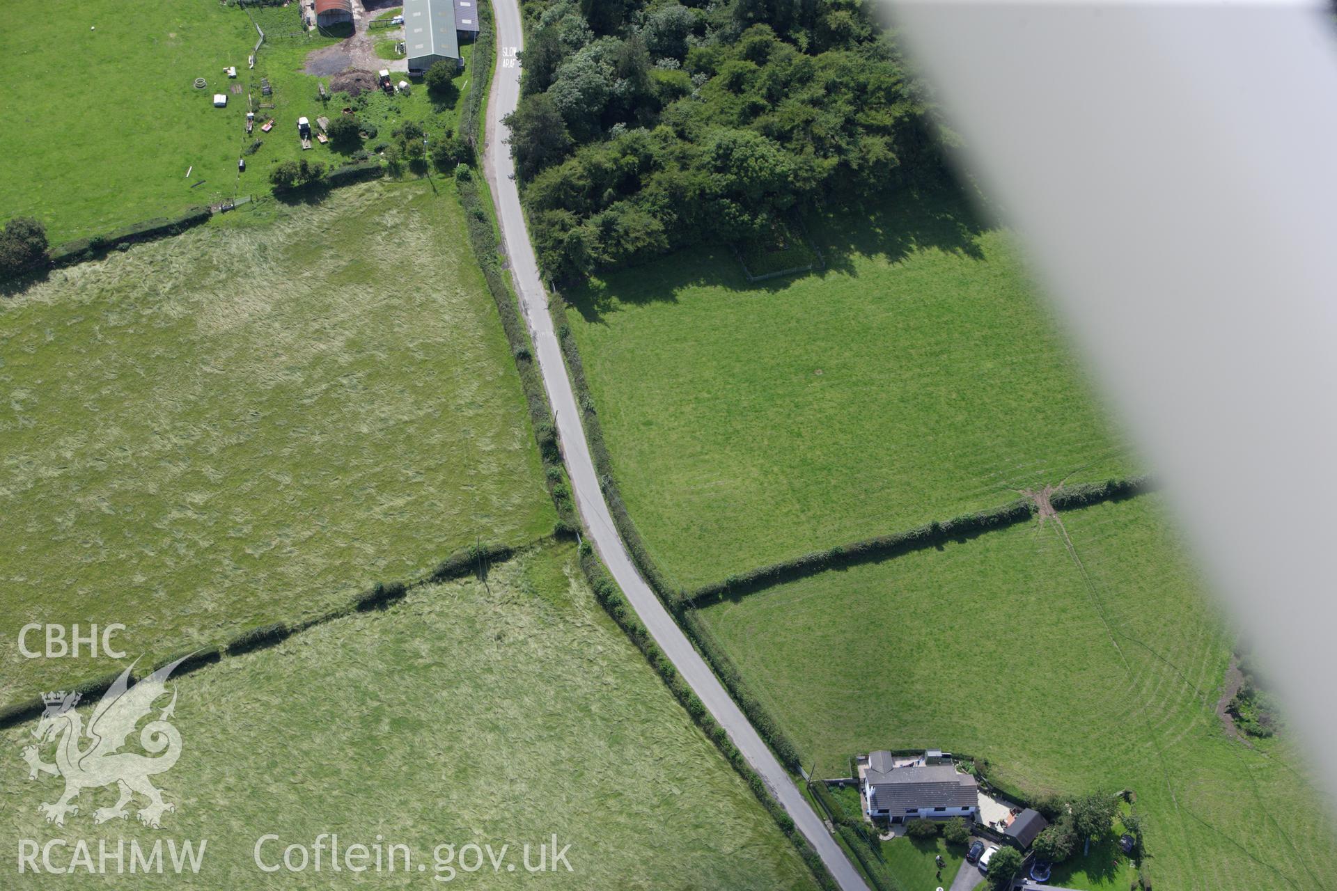 RCAHMW colour oblique aerial photograph of Bryn-Yr-Odyn Barrow. Taken on 30 July 2009 by Toby Driver