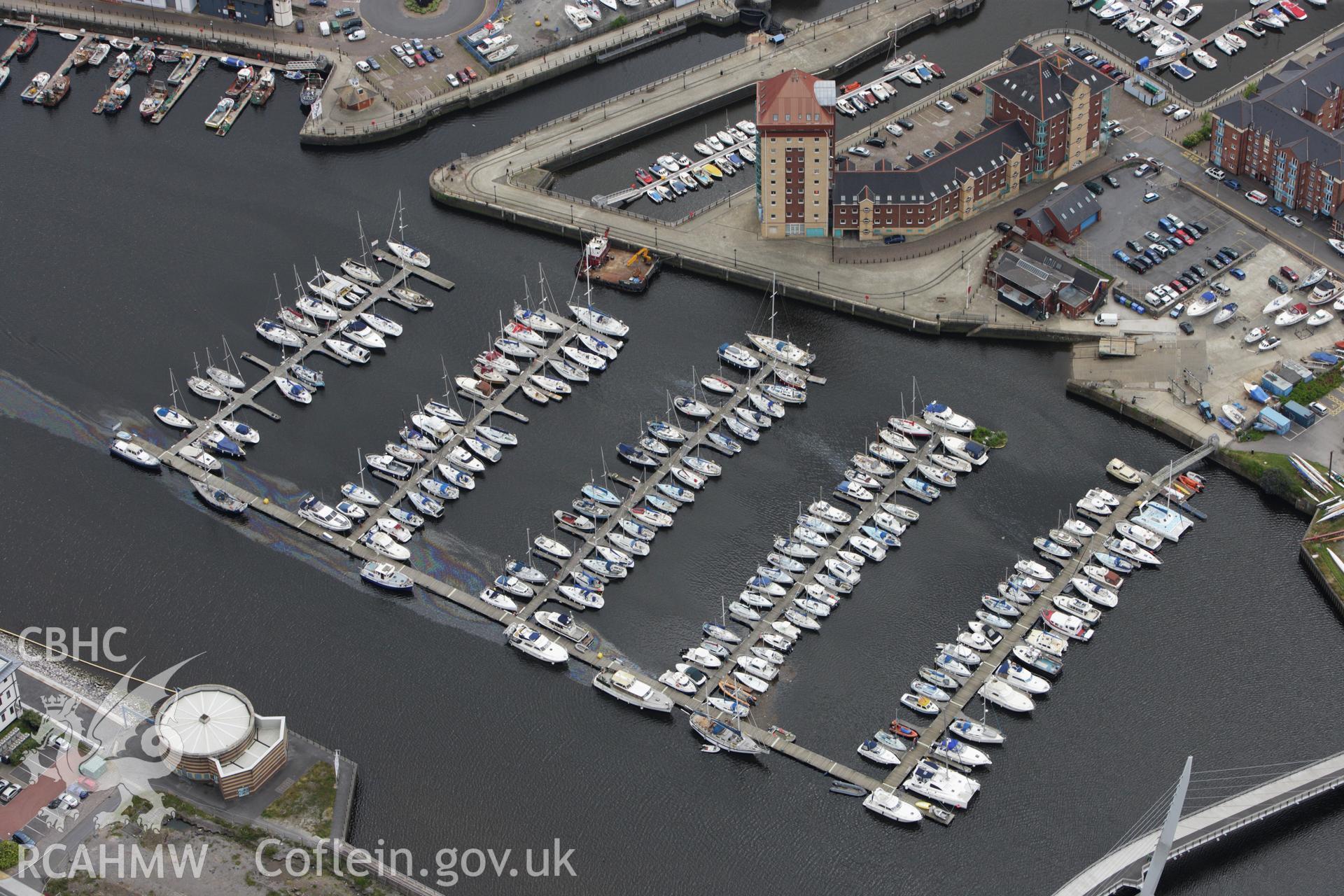 RCAHMW colour oblique aerial photograph of South Dock, now Swansea Marina. Taken on 09 July 2009 by Toby Driver