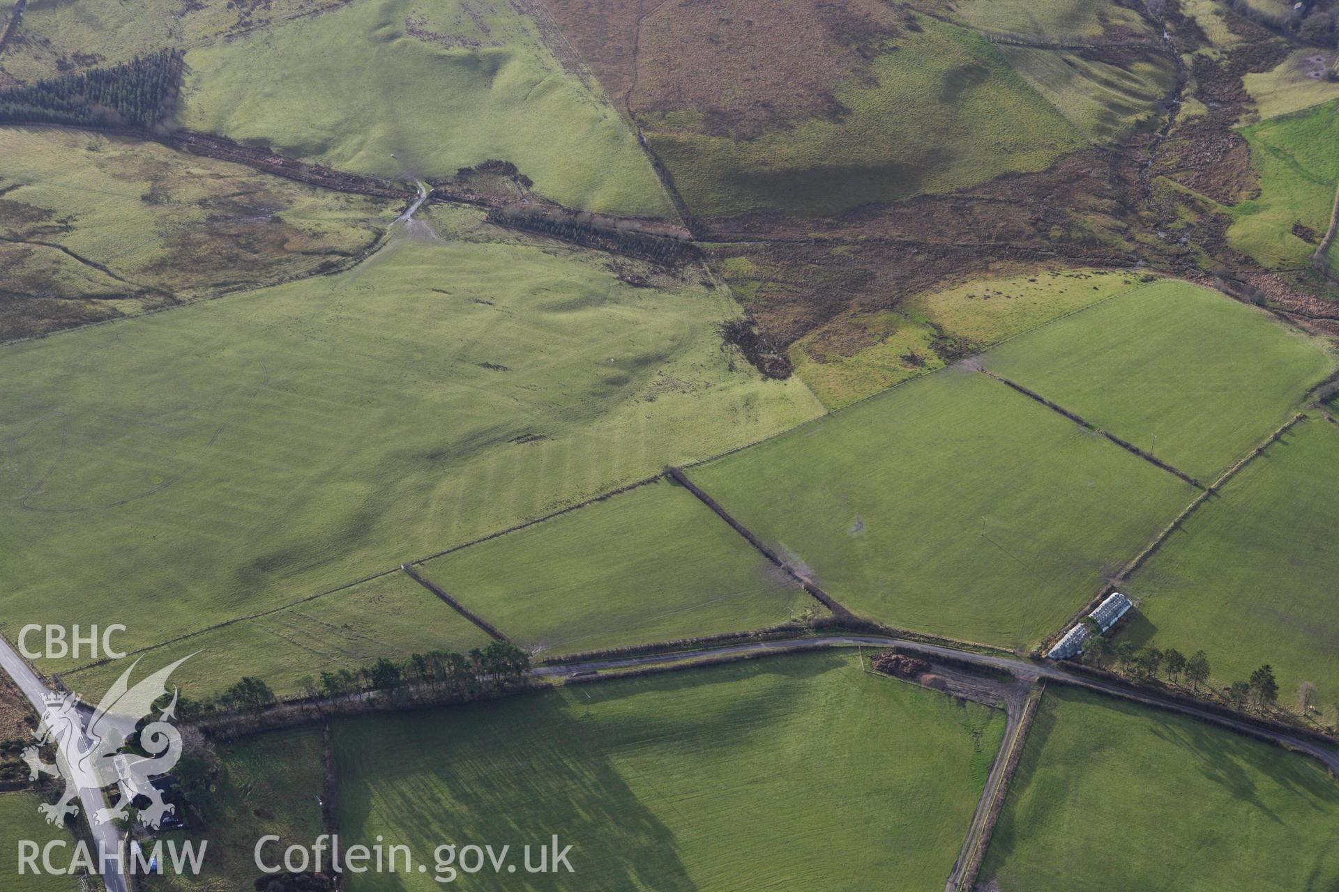 RCAHMW colour oblique aerial photograph of Cwm Nant Marching Camp, St Harmon. Taken on 10 December 2009 by Toby Driver