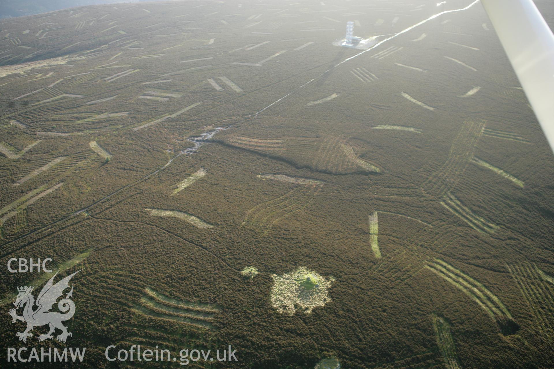 RCAHMW colour oblique aerial photograph of Sir Watkin's Tower, Cairns I and II. Taken on 10 December 2009 by Toby Driver