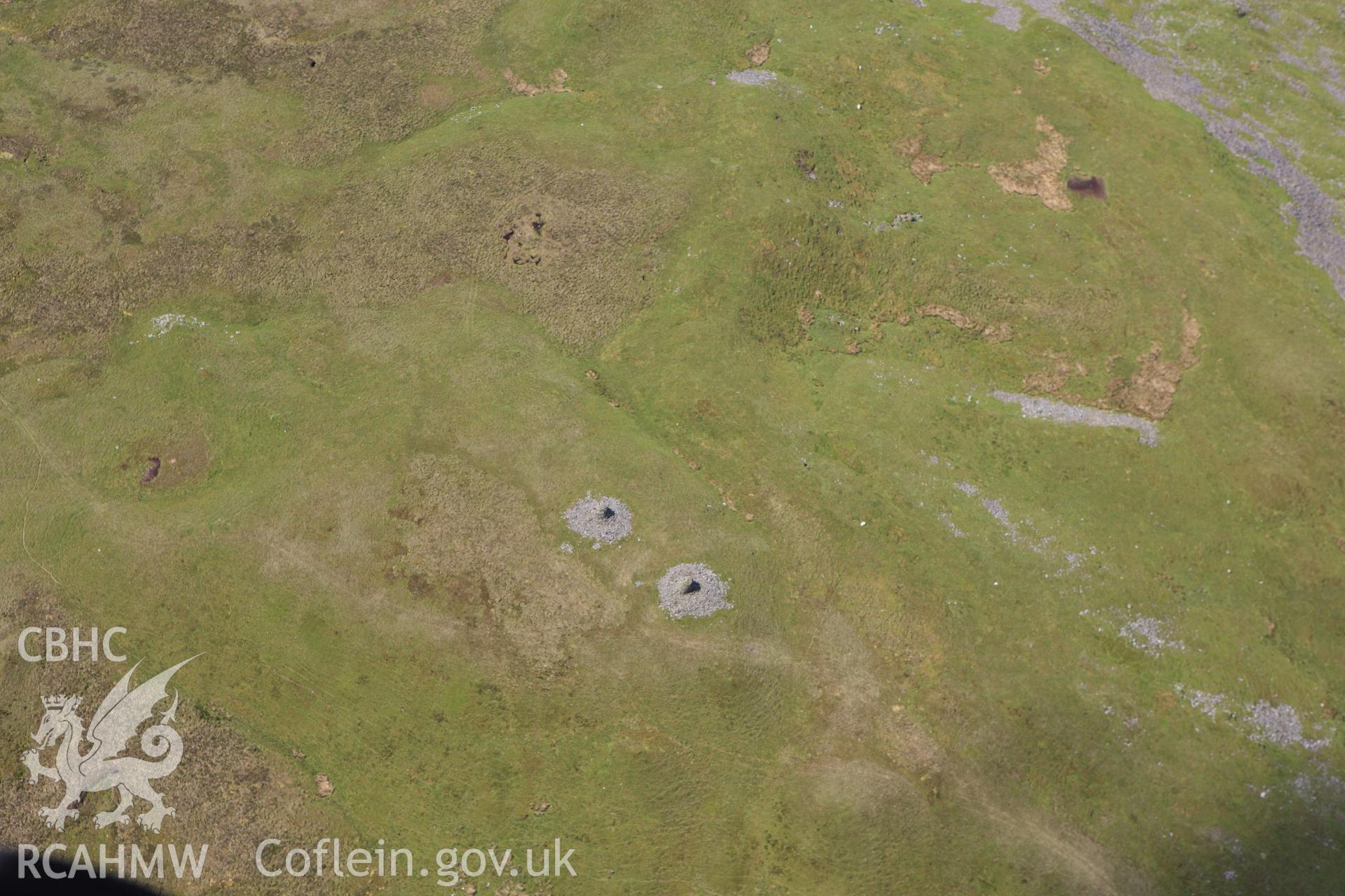 RCAHMW colour oblique aerial photograph of Carn Gwilym Cairns, Carn Hyddgen. Taken on 02 June 2009 by Toby Driver