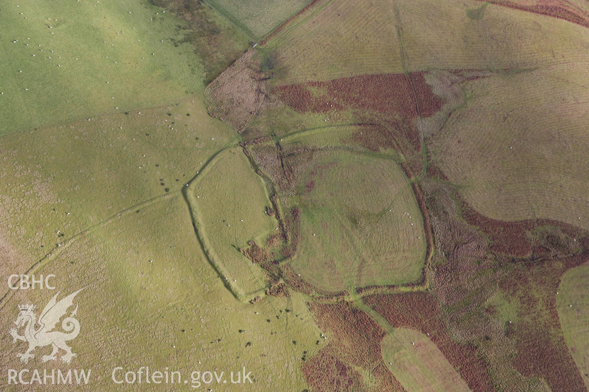 RCAHMW colour oblique aerial photograph of Castle Bank Enclosure Complex. Taken on 10 December 2009 by Toby Driver