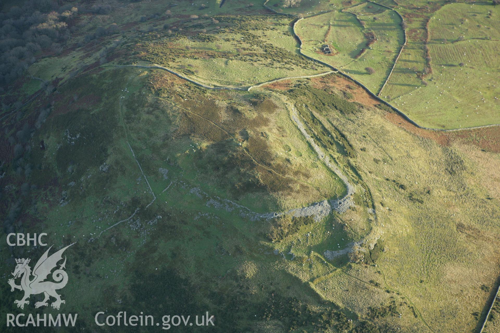 RCAHMW colour oblique aerial photograph of Pen-y-Gaer Hillfort. Taken on 10 December 2009 by Toby Driver