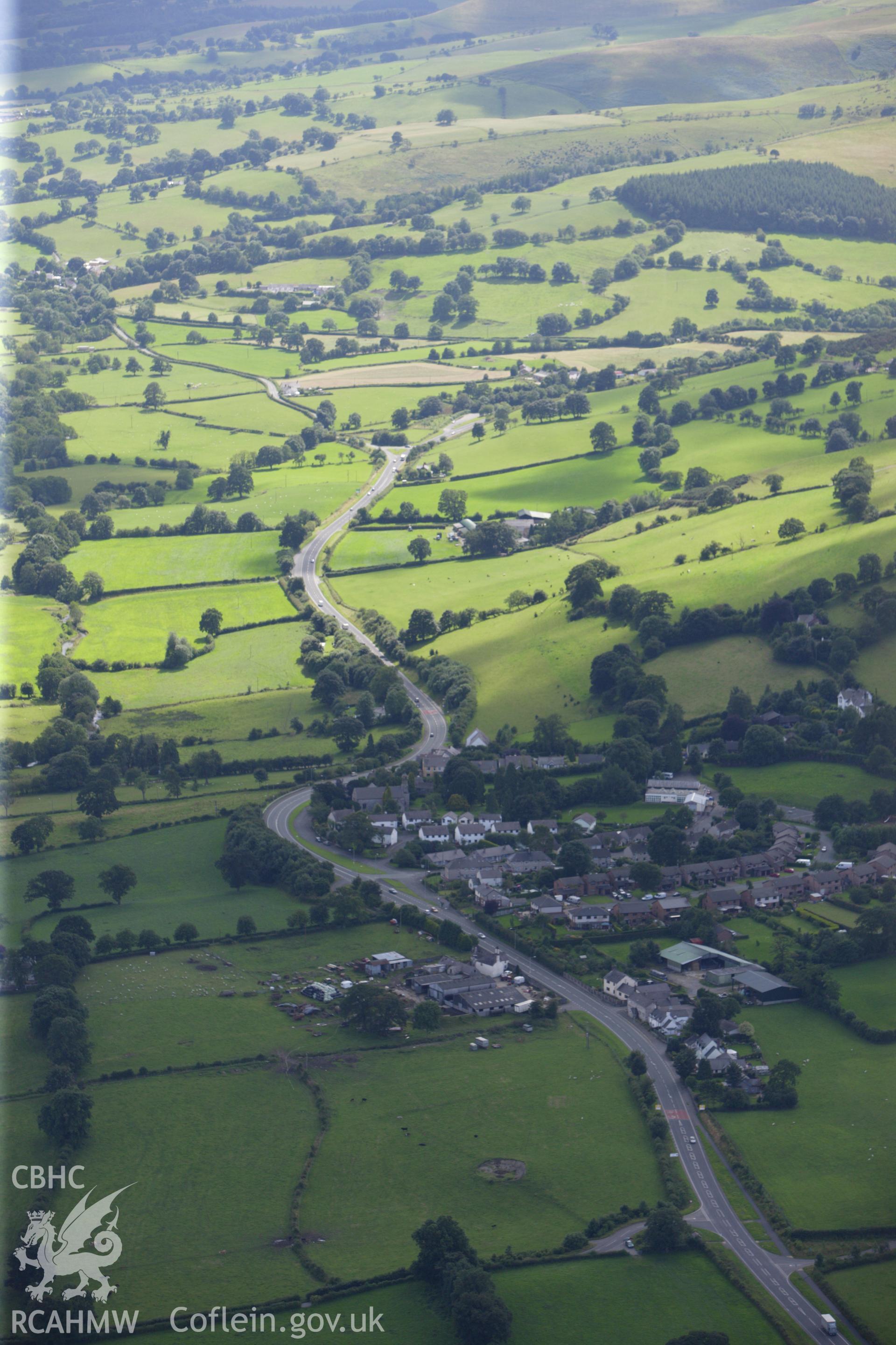 RCAHMW colour oblique aerial photograph of Llanferres village. Taken on 30 July 2009 by Toby Driver