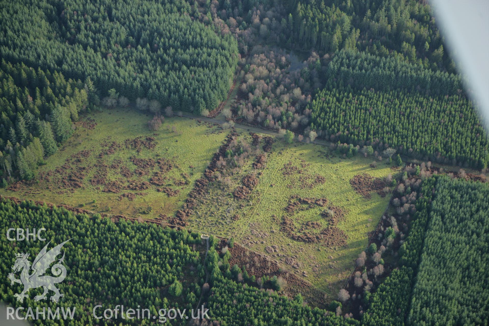 RCAHMW colour oblique aerial photograph of Caerau Enclosures I and II, Pont Petryal. Taken on 10 December 2009 by Toby Driver