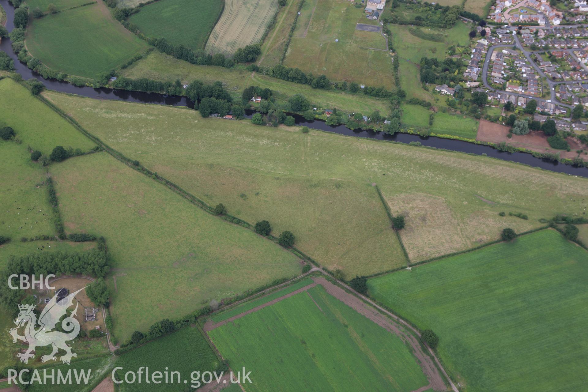 RCAHMW colour oblique aerial photograph of Holt Roman site. Taken on 08 July 2009 by Toby Driver