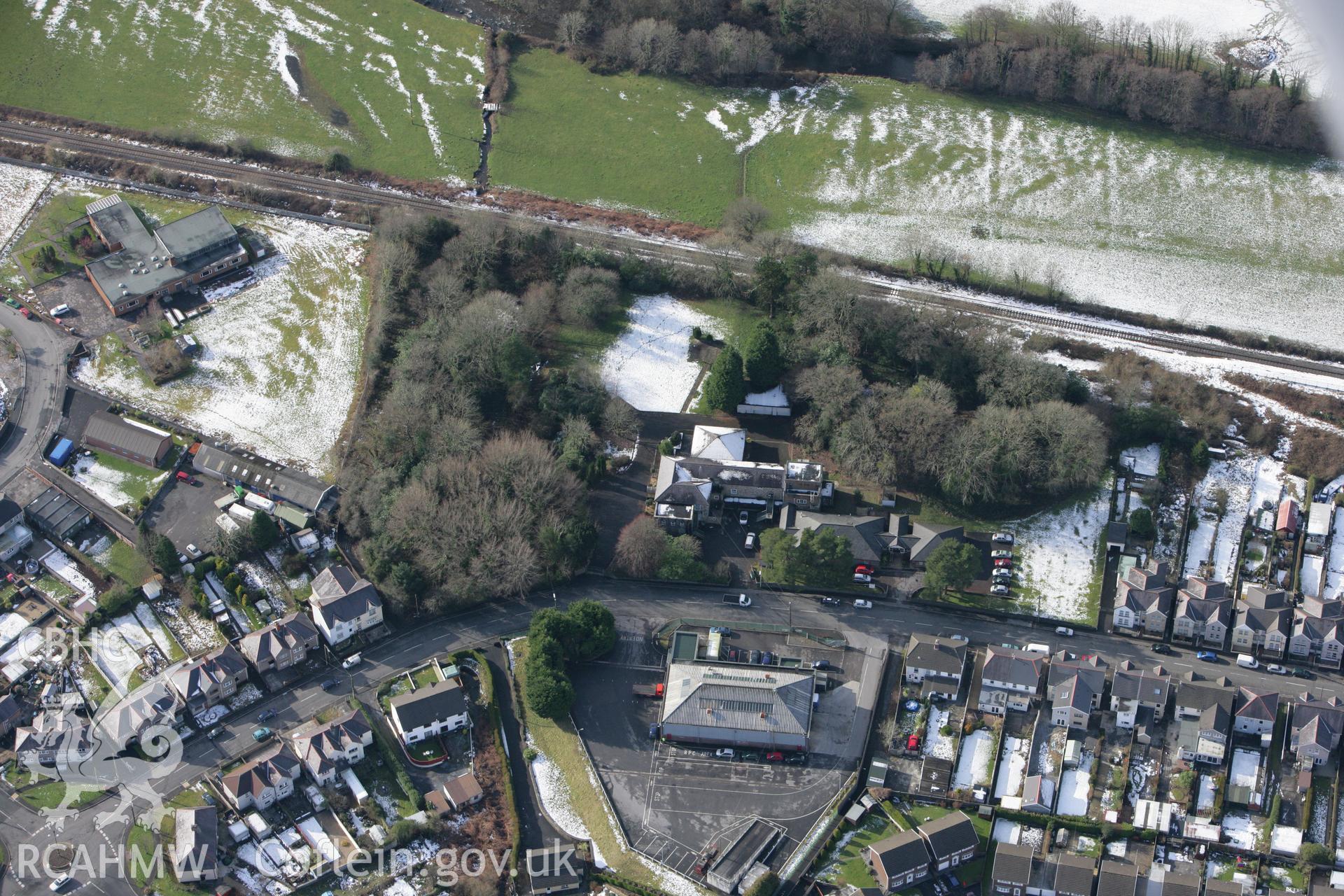 RCAHMW colour oblique photograph of Tir-y-Dail motte and bailey, Ammanford. Taken by Toby Driver on 06/02/2009.