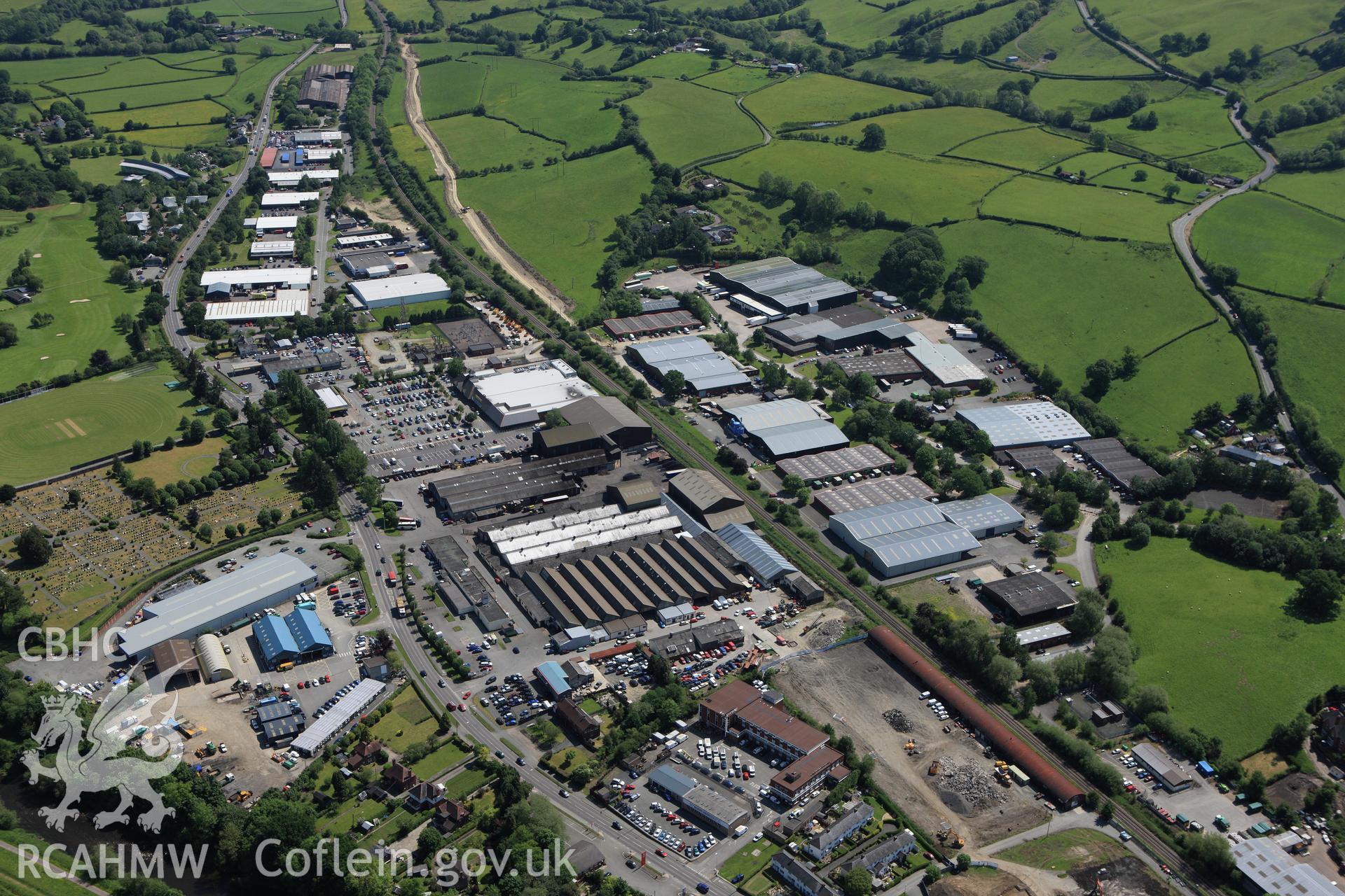 RCAHMW colour oblique aerial photograph of Lion Works, Aircraft factory, Newtown Industrial Estate. Taken on 02 June 2009 by Toby Driver