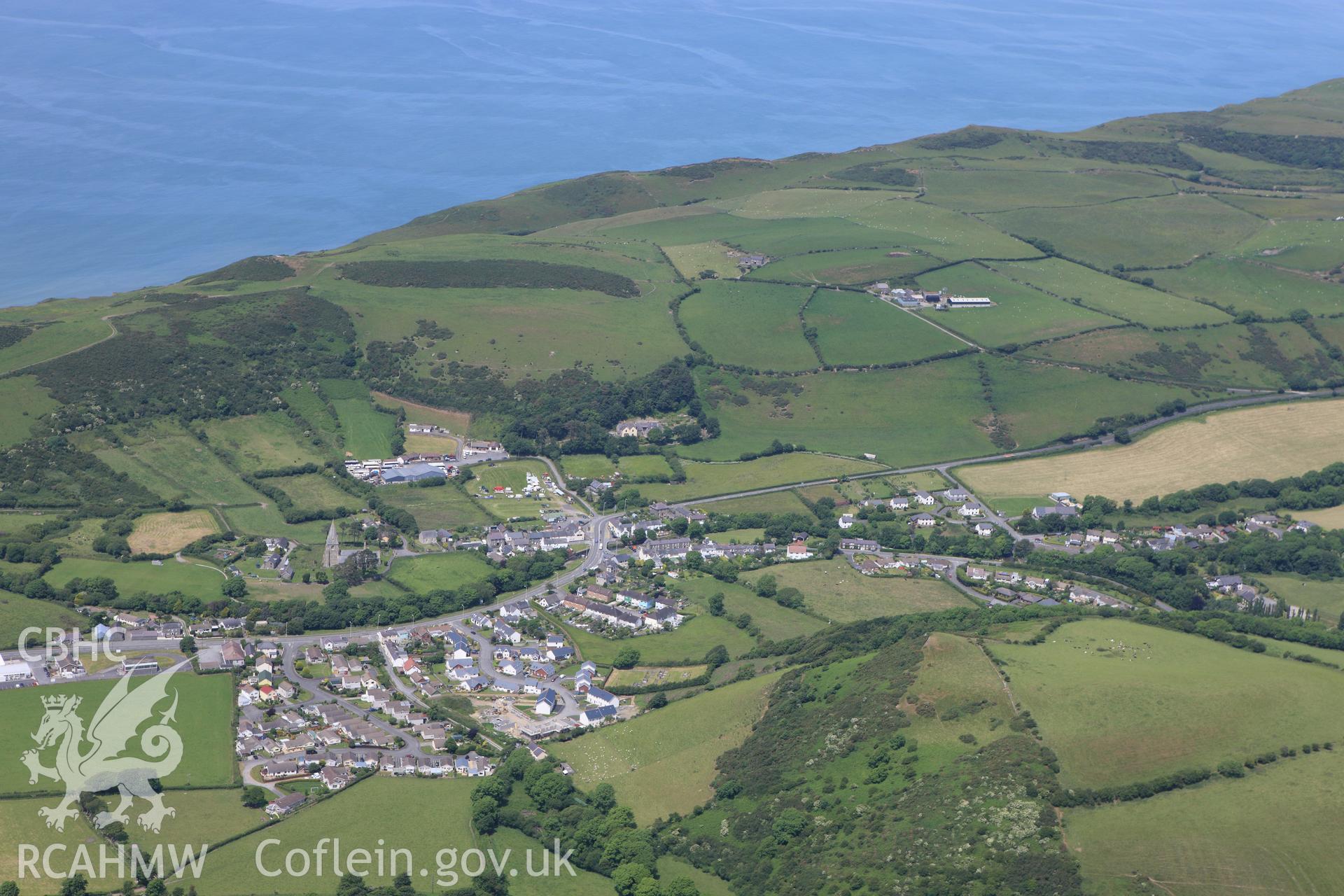 RCAHMW colour oblique aerial photograph of Llanrhystyd village. Taken on 16 June 2009 by Toby Driver