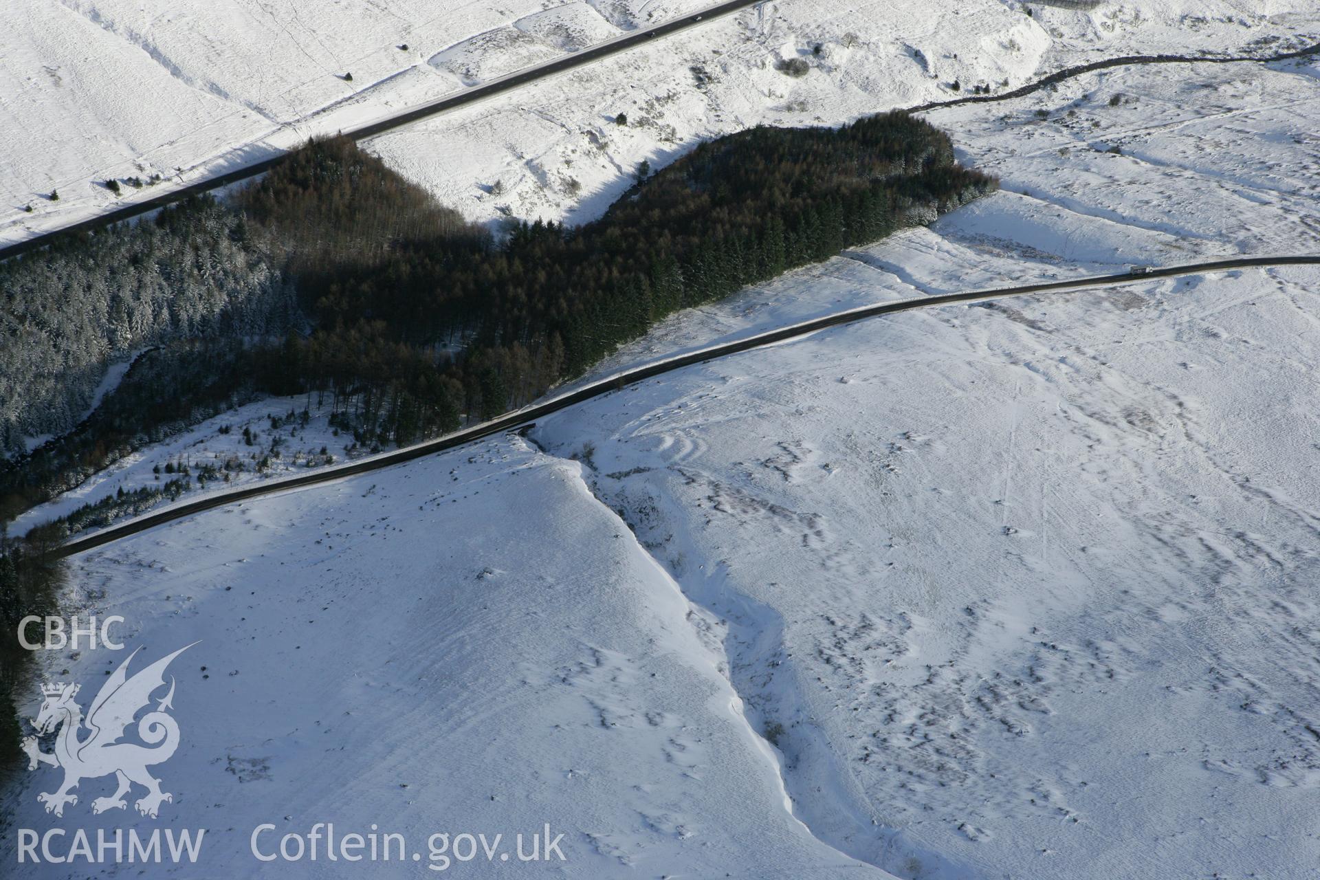 RCAHMW colour oblique photograph of Rhyd Uchaf enclosure. Taken by Toby Driver on 06/02/2009.