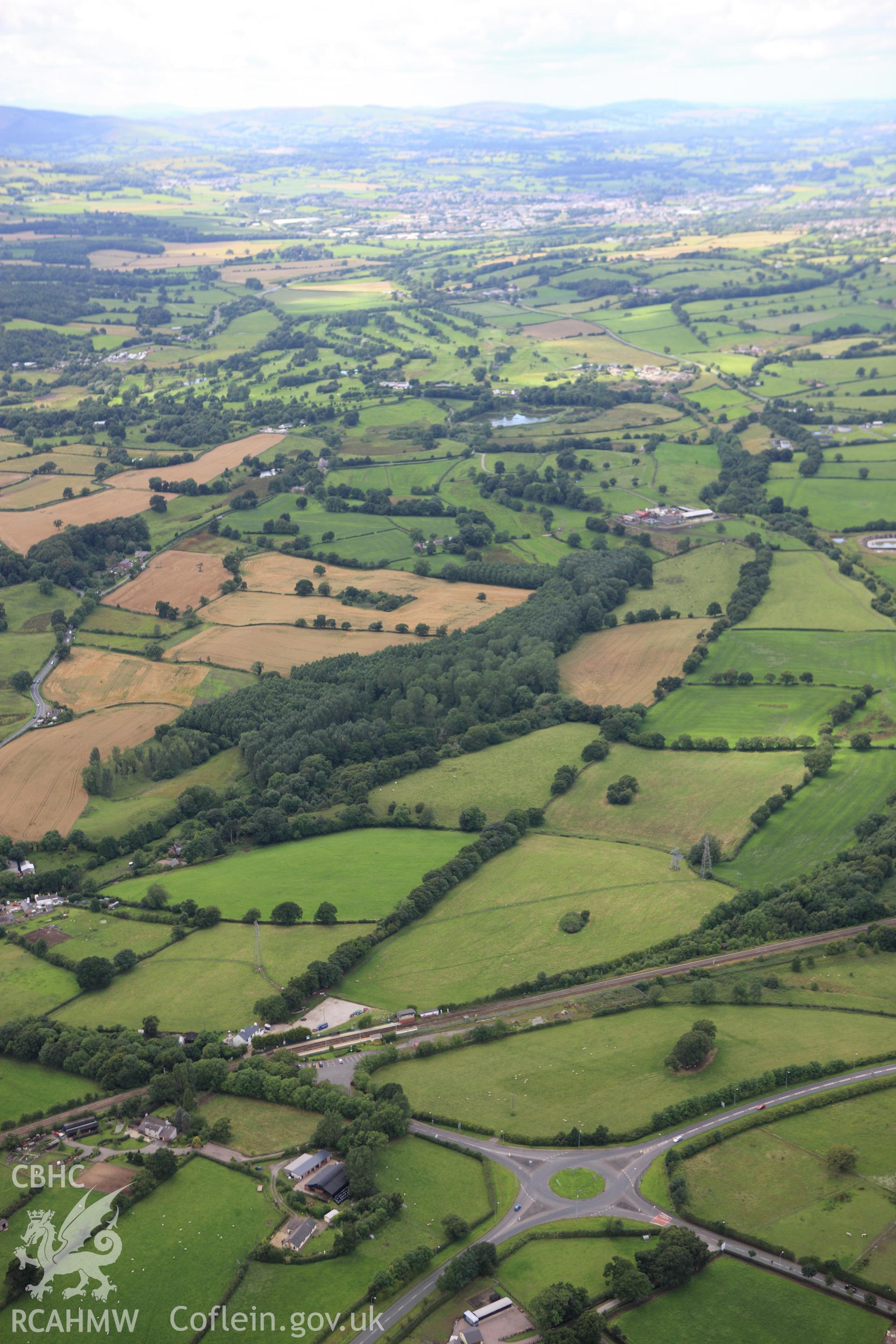 RCAHMW colour oblique aerial photograph of Wat's Dyke west of Rhos-y-Brwyner. Taken on 30 July 2009 by Toby Driver